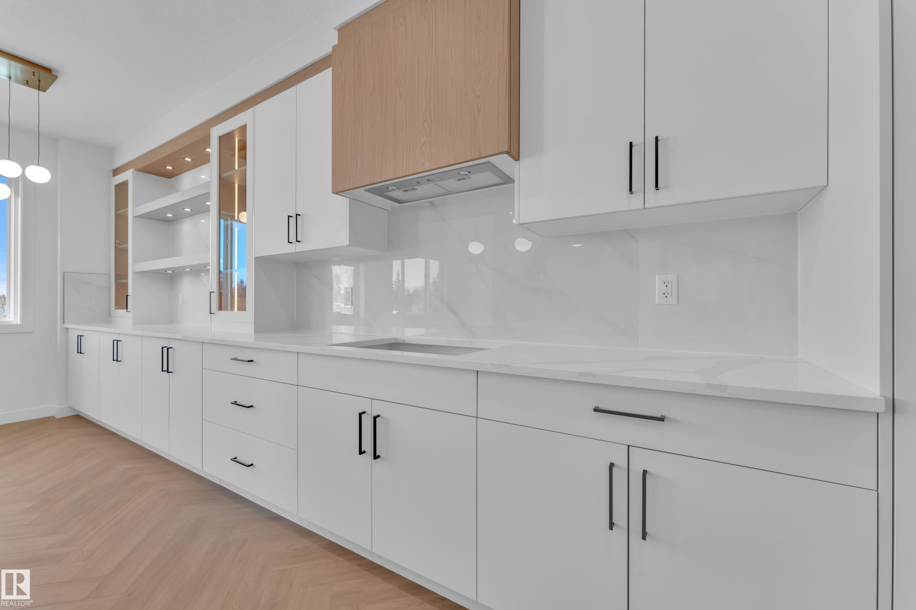 Kitchen featuring hanging light fixtures, parquet floors, open shelves, decorative backsplash, and light stone counters - 38 Grayson Green, Stony Plain, AB - Indoor Photo Showing Other Room