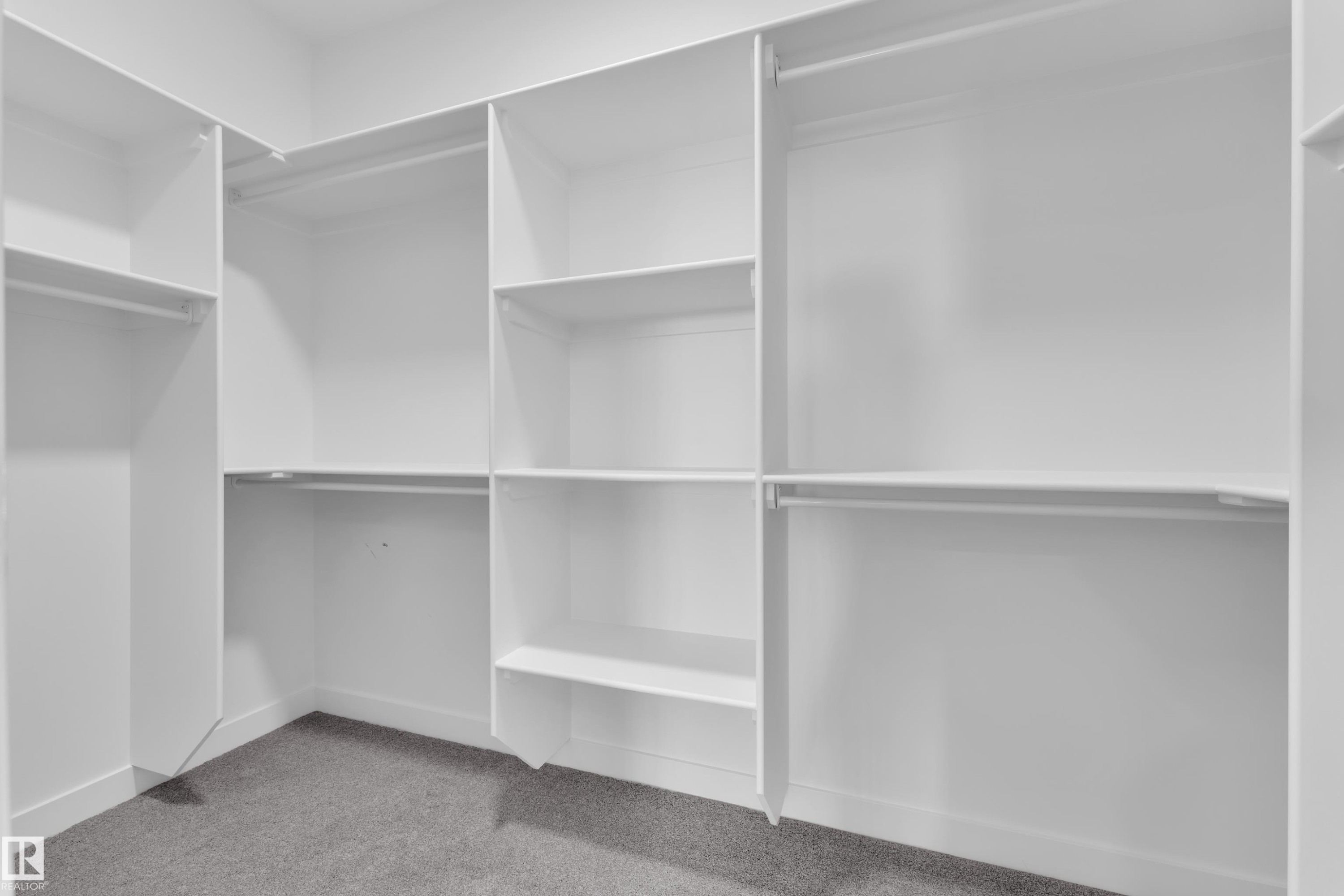 Walk in closet with light colored carpet - 38 Grayson Green, Stony Plain, AB - Indoor With Storage