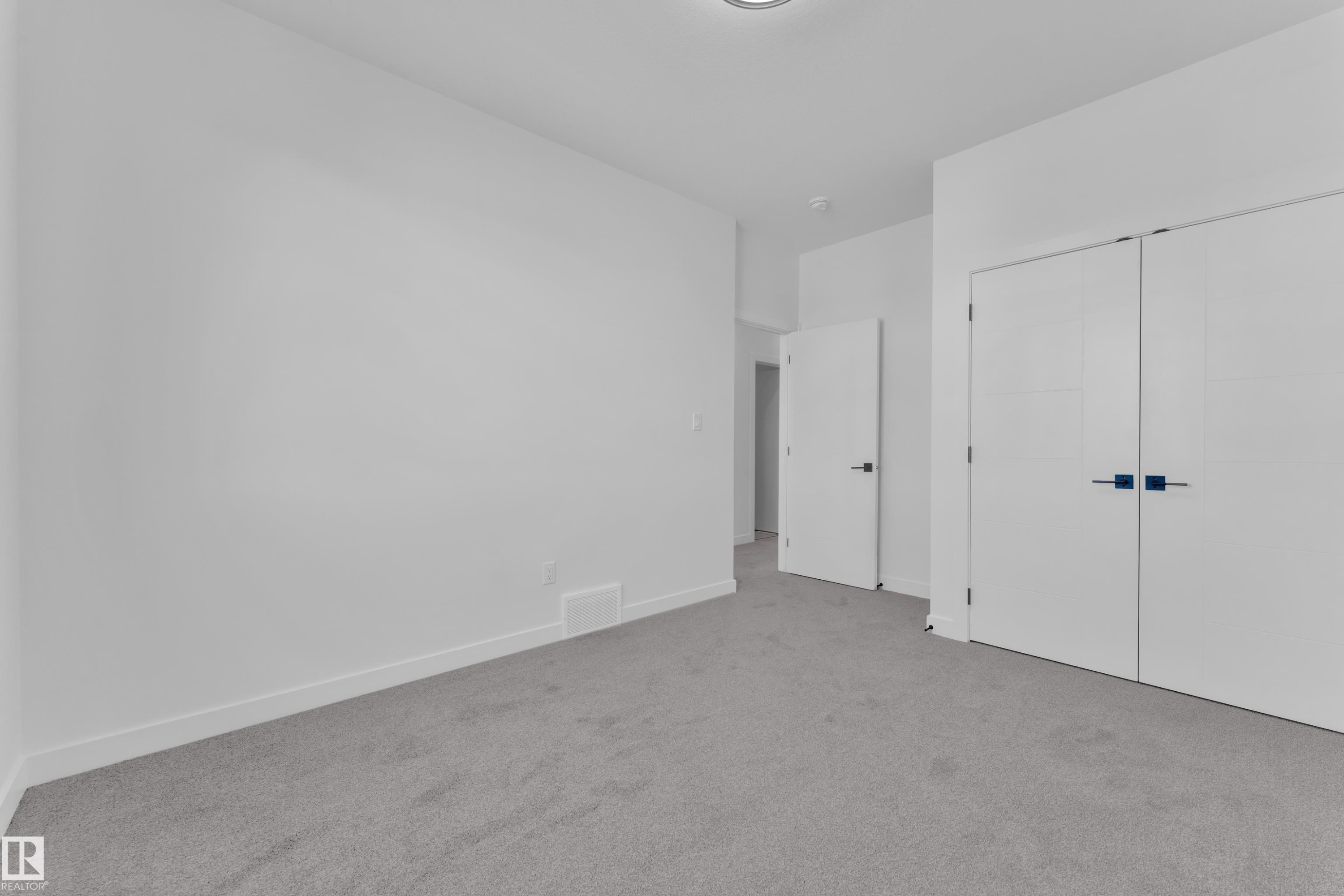 Unfurnished bedroom featuring carpet flooring and a closet - 38 Grayson Green, Stony Plain, AB - Indoor Photo Showing Other Room