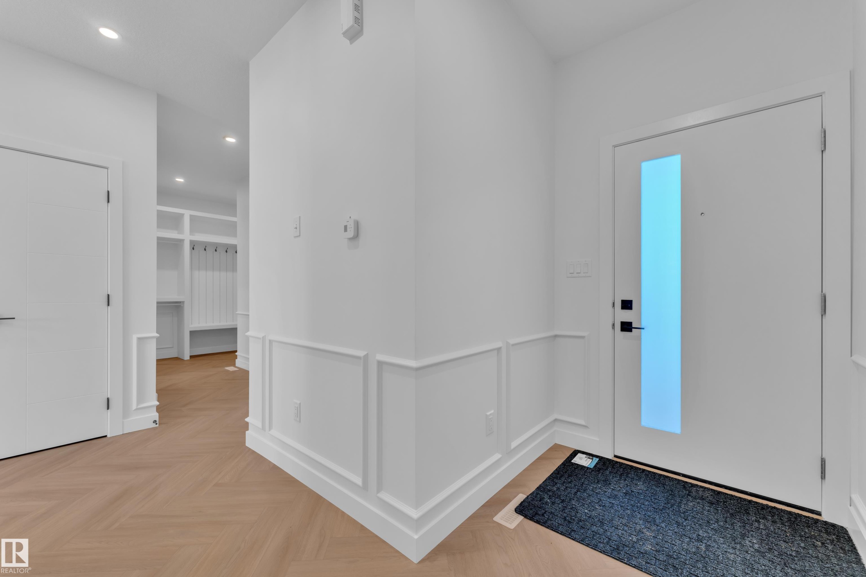 Foyer featuring parquet floors, recessed lighting, a decorative wall, and a wainscoted wall - 38 Grayson Green, Stony Plain, AB - Indoor Photo Showing Other Room