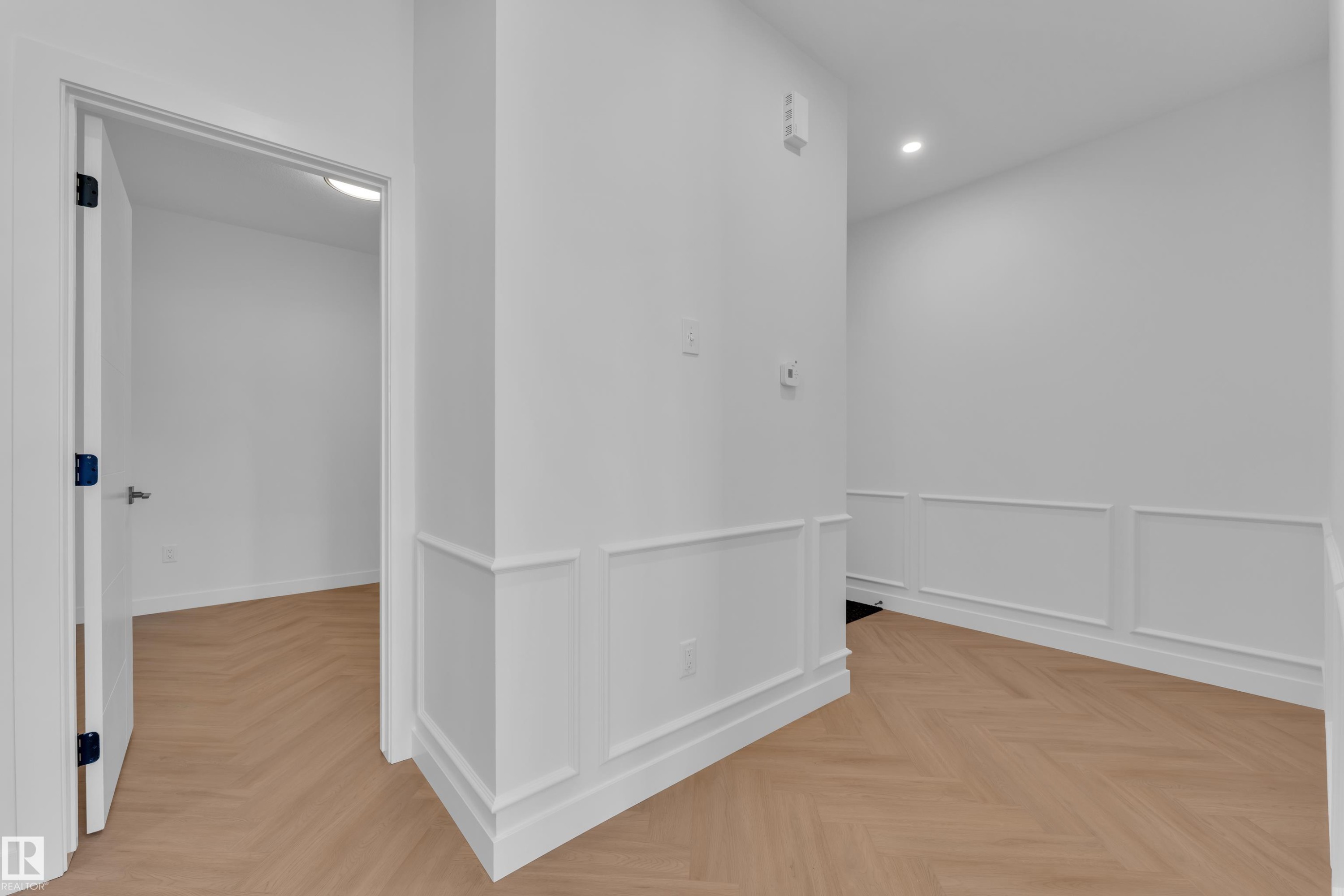 Hall with parquet flooring, recessed lighting, and a wainscoted wall - 38 Grayson Green, Stony Plain, AB - Indoor Photo Showing Other Room