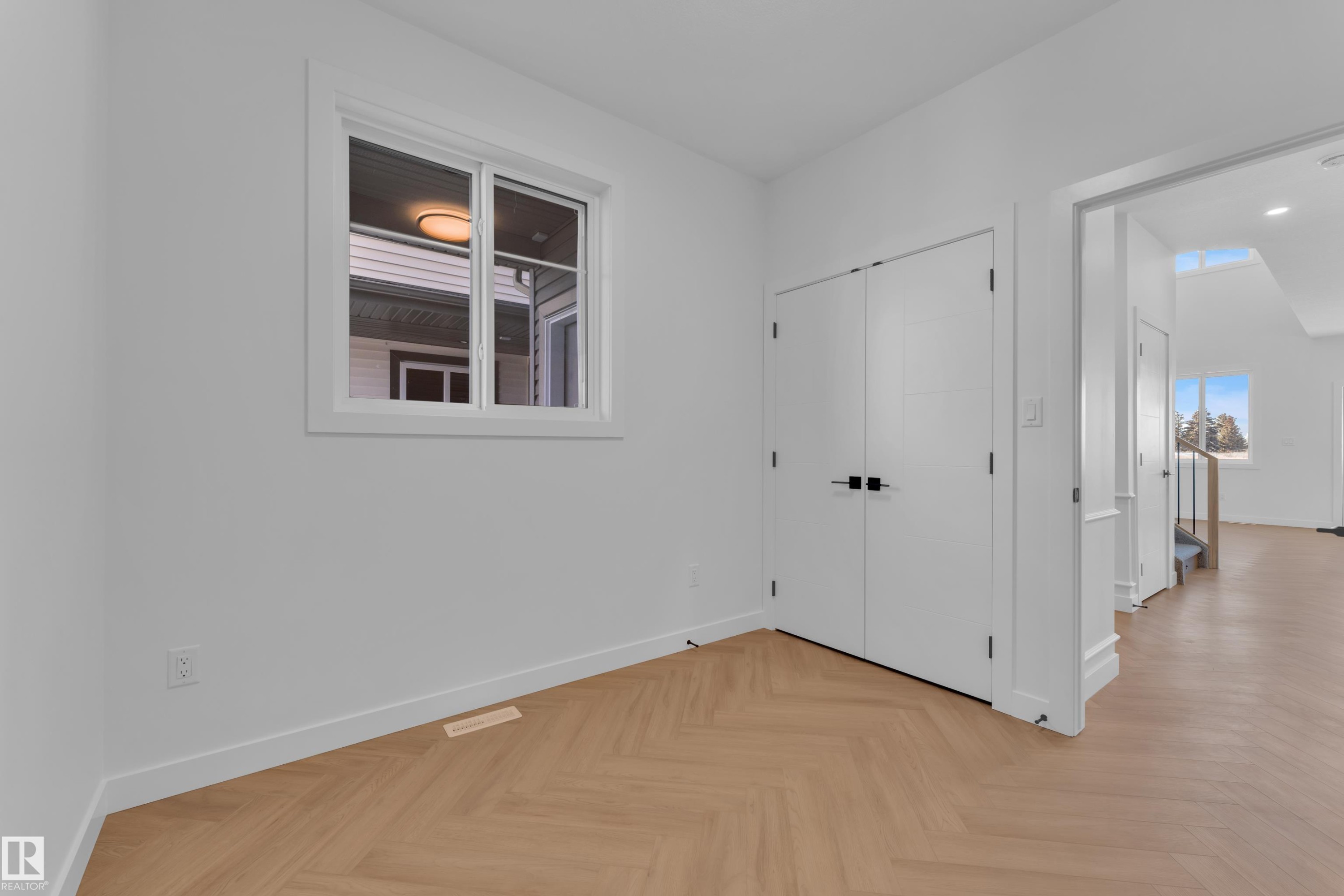 Unfurnished bedroom with parquet floors and a closet - 38 Grayson Green, Stony Plain, AB - Indoor Photo Showing Other Room