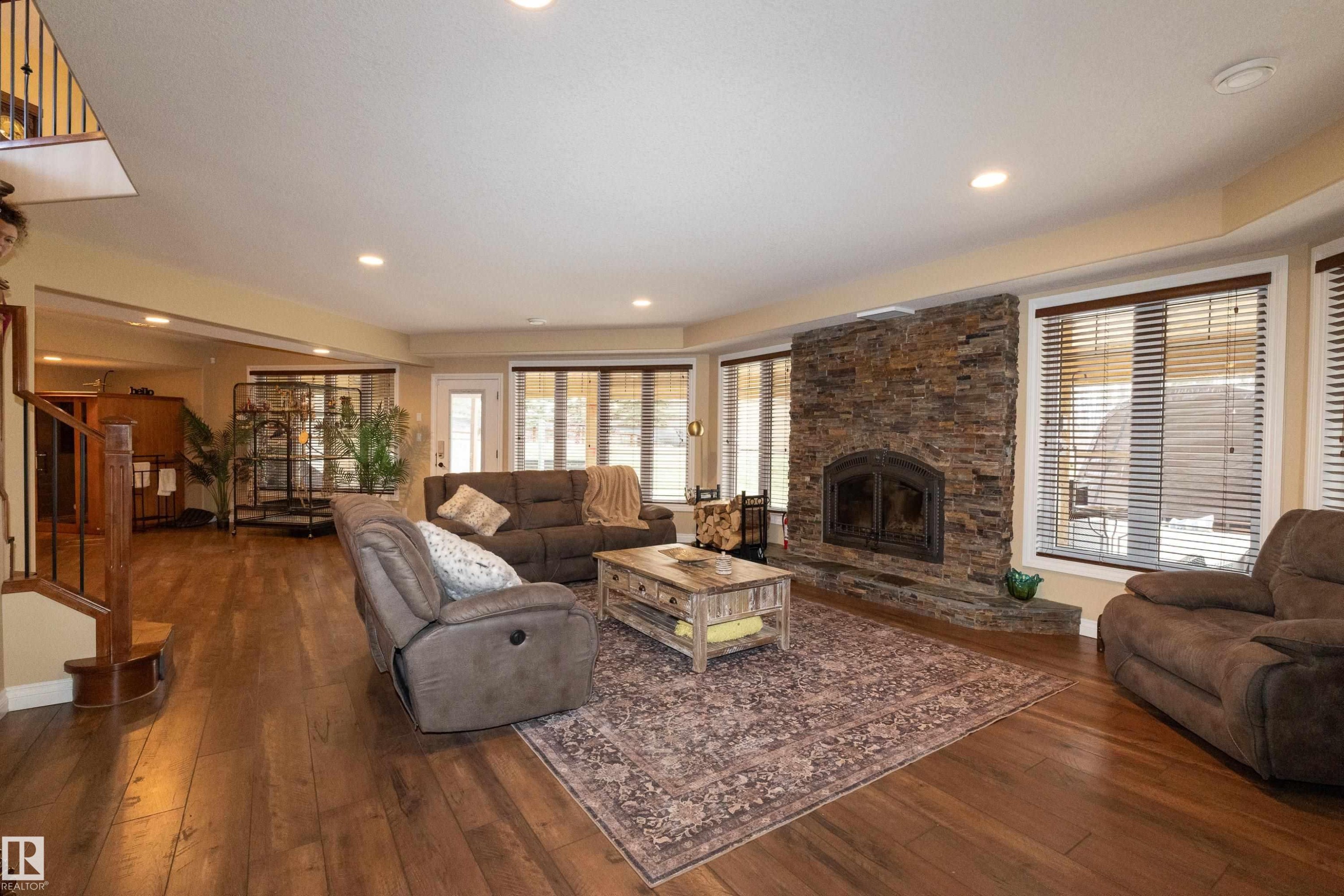 #14 52001 Rge Road 275, Rural Parkland County, AB - Indoor Photo Showing Living Room With Fireplace