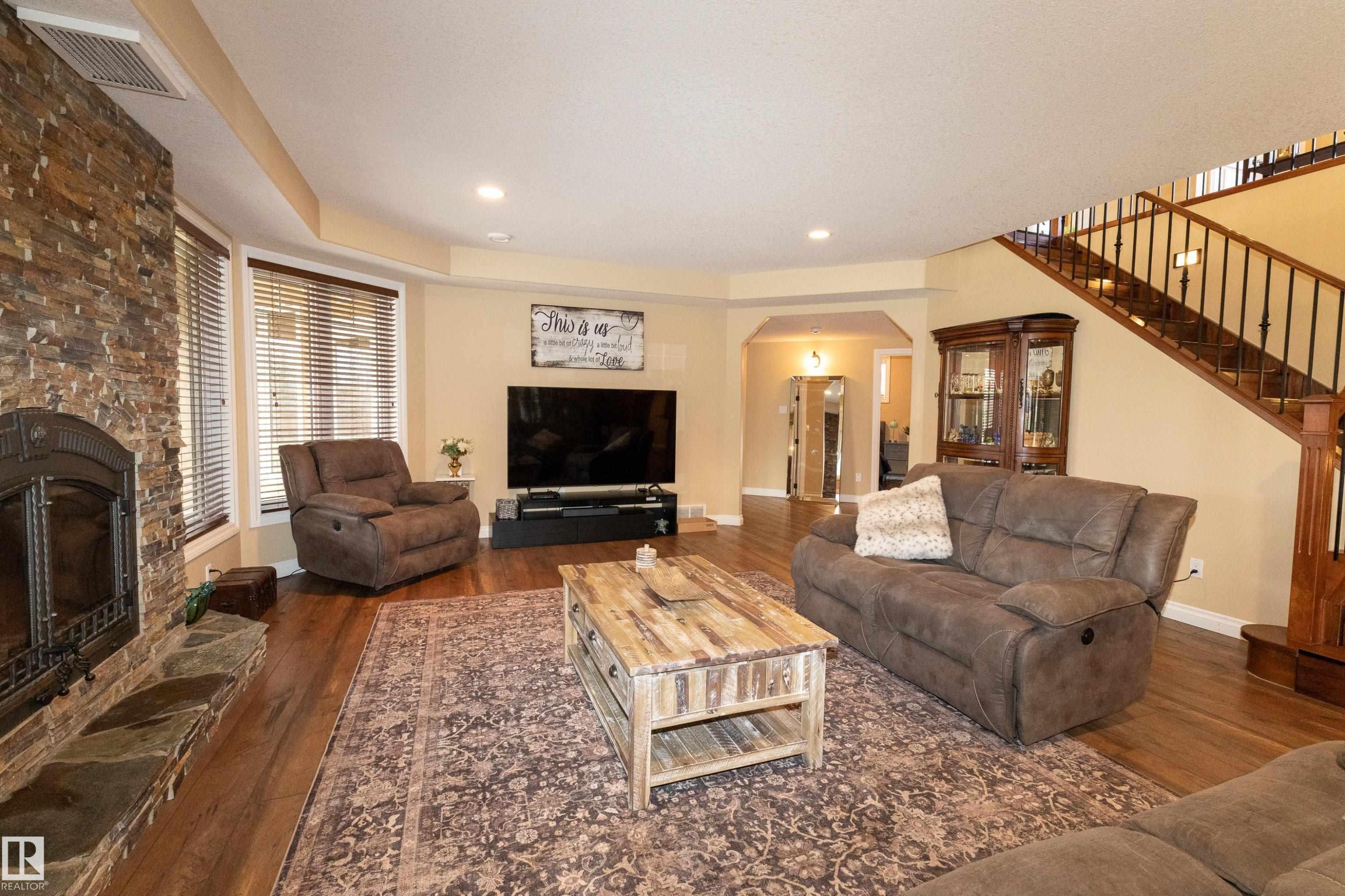 #14 52001 Rge Road 275, Rural Parkland County, AB - Indoor Photo Showing Living Room With Fireplace