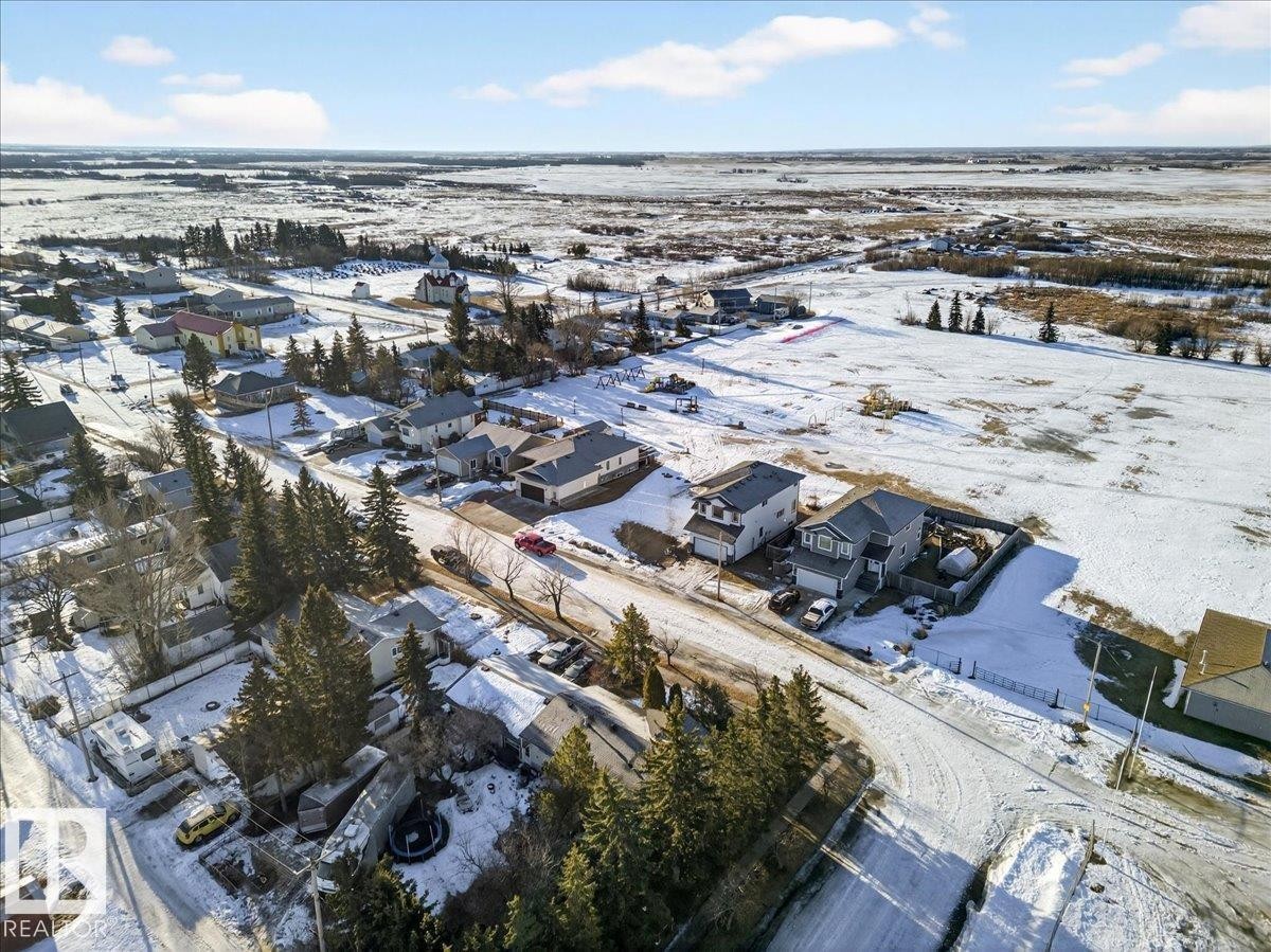 Snowy aerial view featuring a residential view - 5019 48 Avenue, Chipman, AB - Outdoor With View