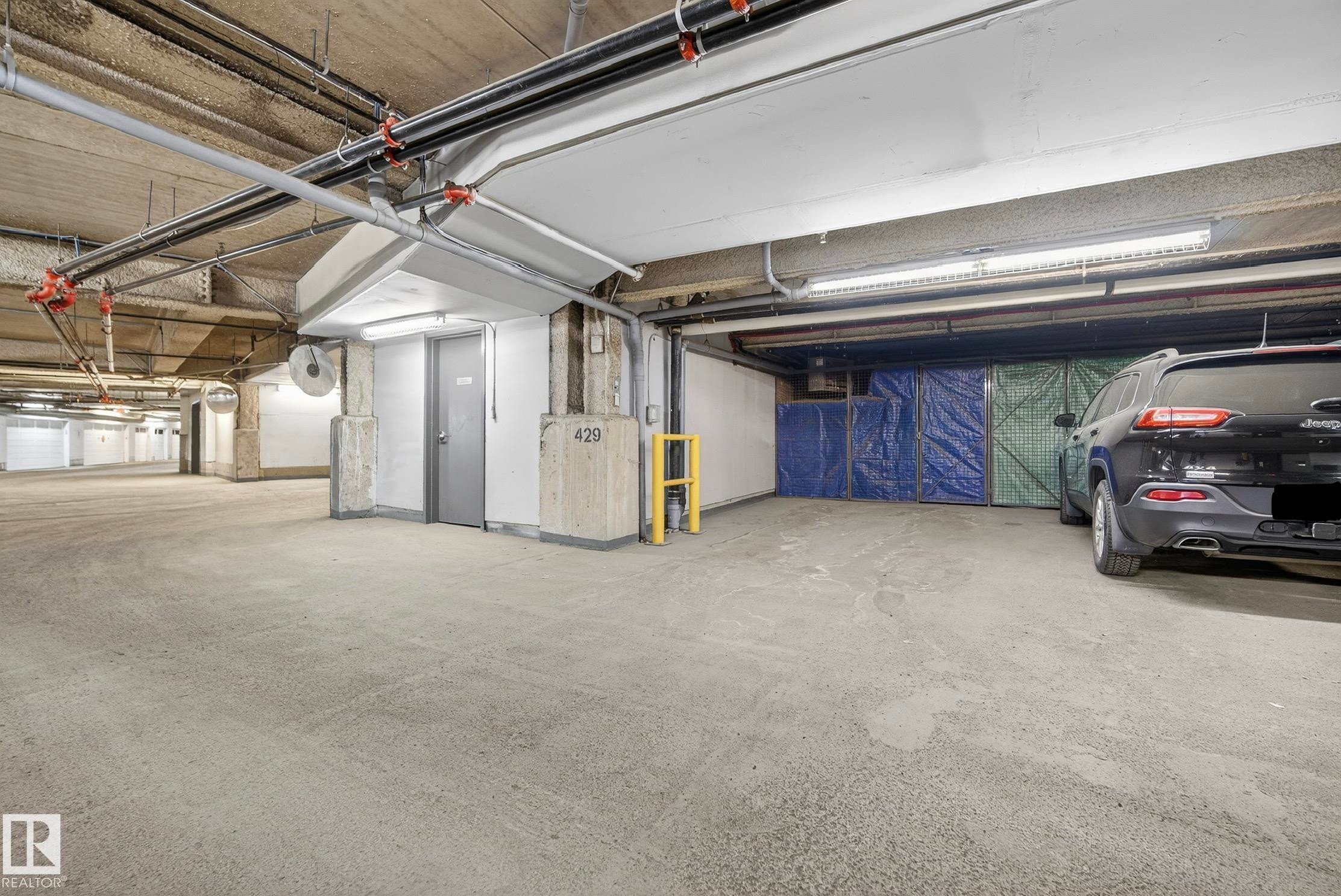 201 5151 Windermere Boulevard, Edmonton, AB - Indoor Photo Showing Garage