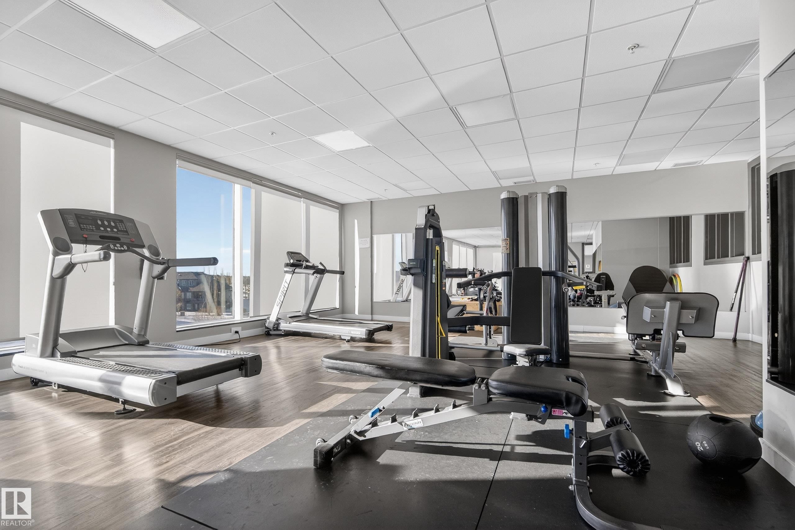 201 5151 Windermere Boulevard, Edmonton, AB - Indoor Photo Showing Gym Room