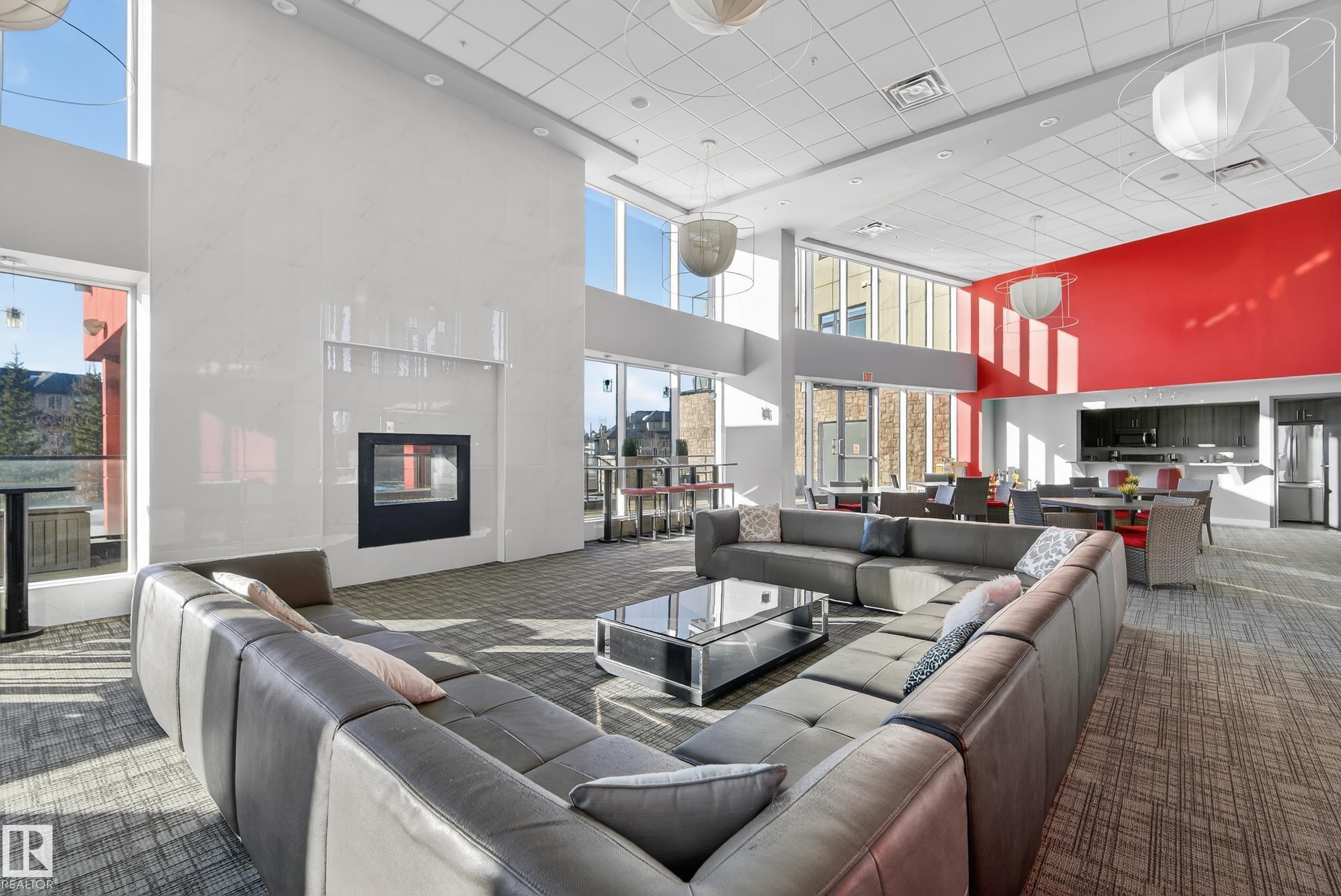 201 5151 Windermere Boulevard, Edmonton, AB - Indoor Photo Showing Living Room With Fireplace