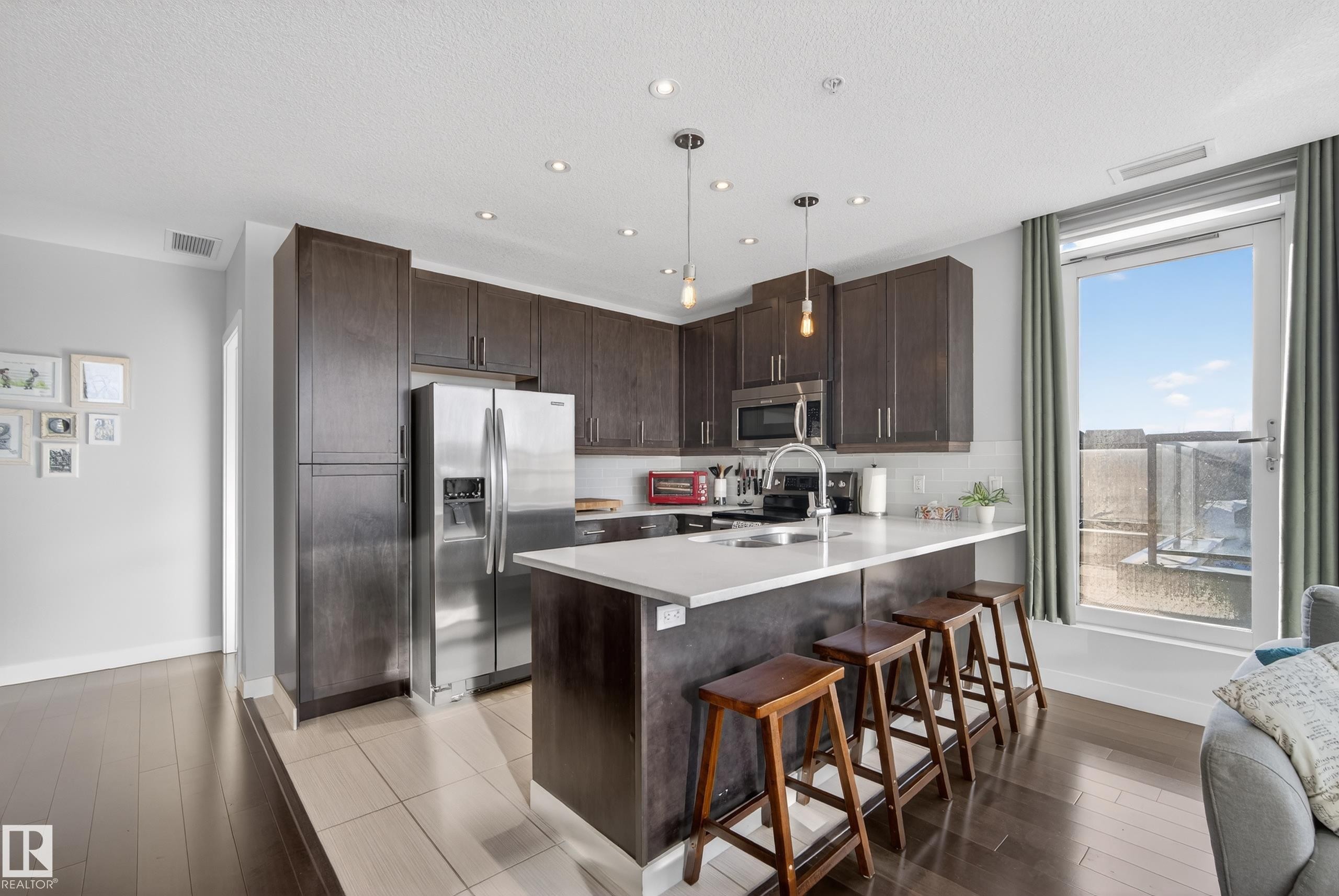 201 5151 Windermere Boulevard, Edmonton, AB - Indoor Photo Showing Kitchen With Upgraded Kitchen