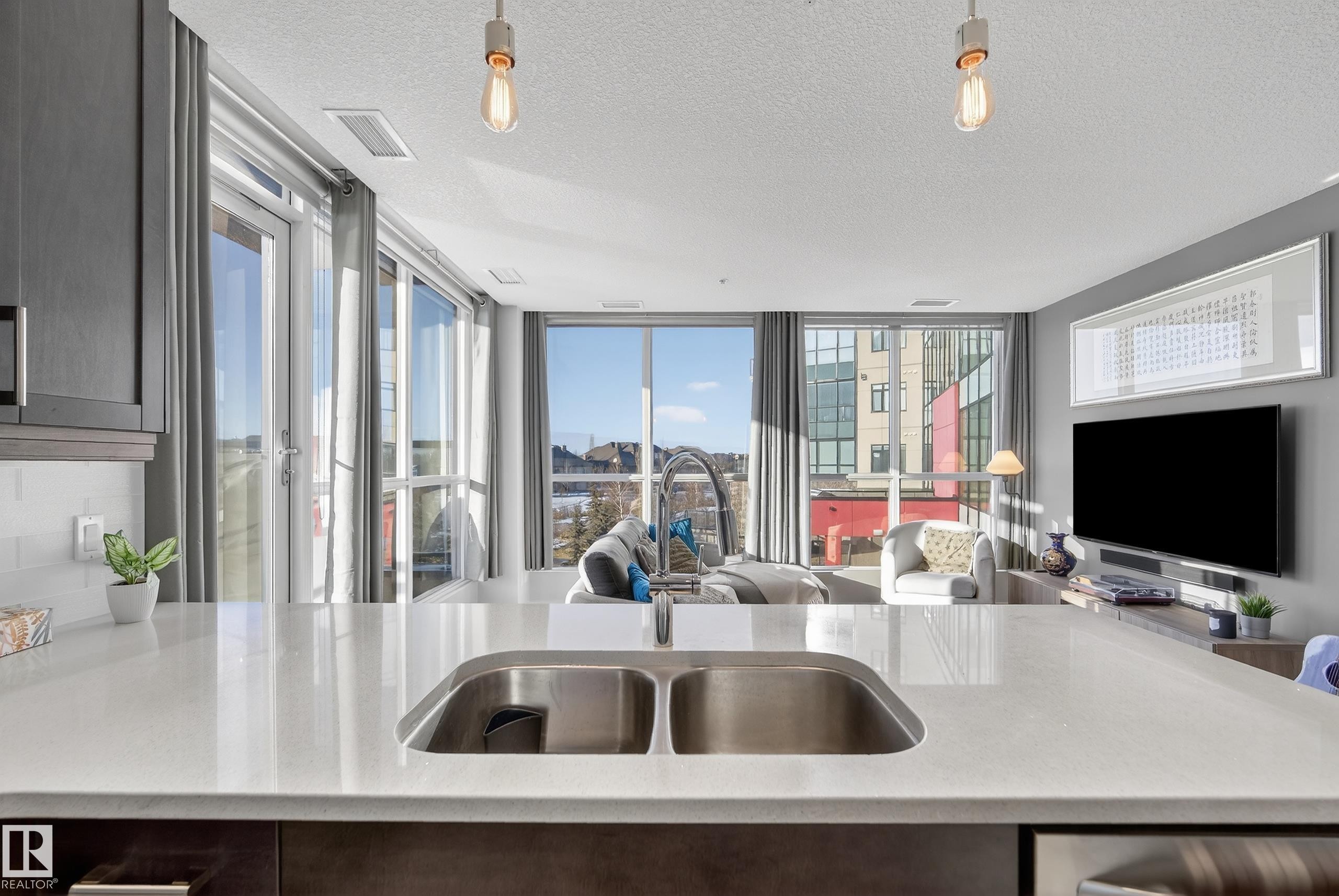 201 5151 Windermere Boulevard, Edmonton, AB - Indoor Photo Showing Kitchen With Double Sink