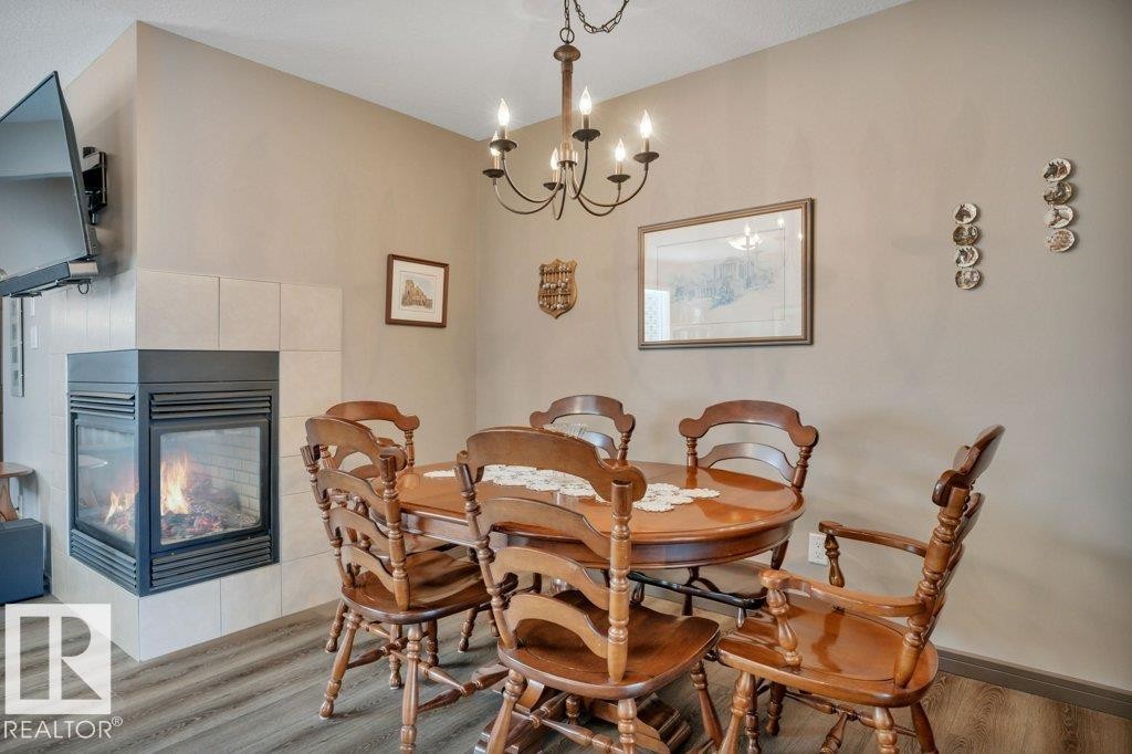 497 Chappelle Drive, Edmonton, AB - Indoor Photo Showing Dining Room With Fireplace