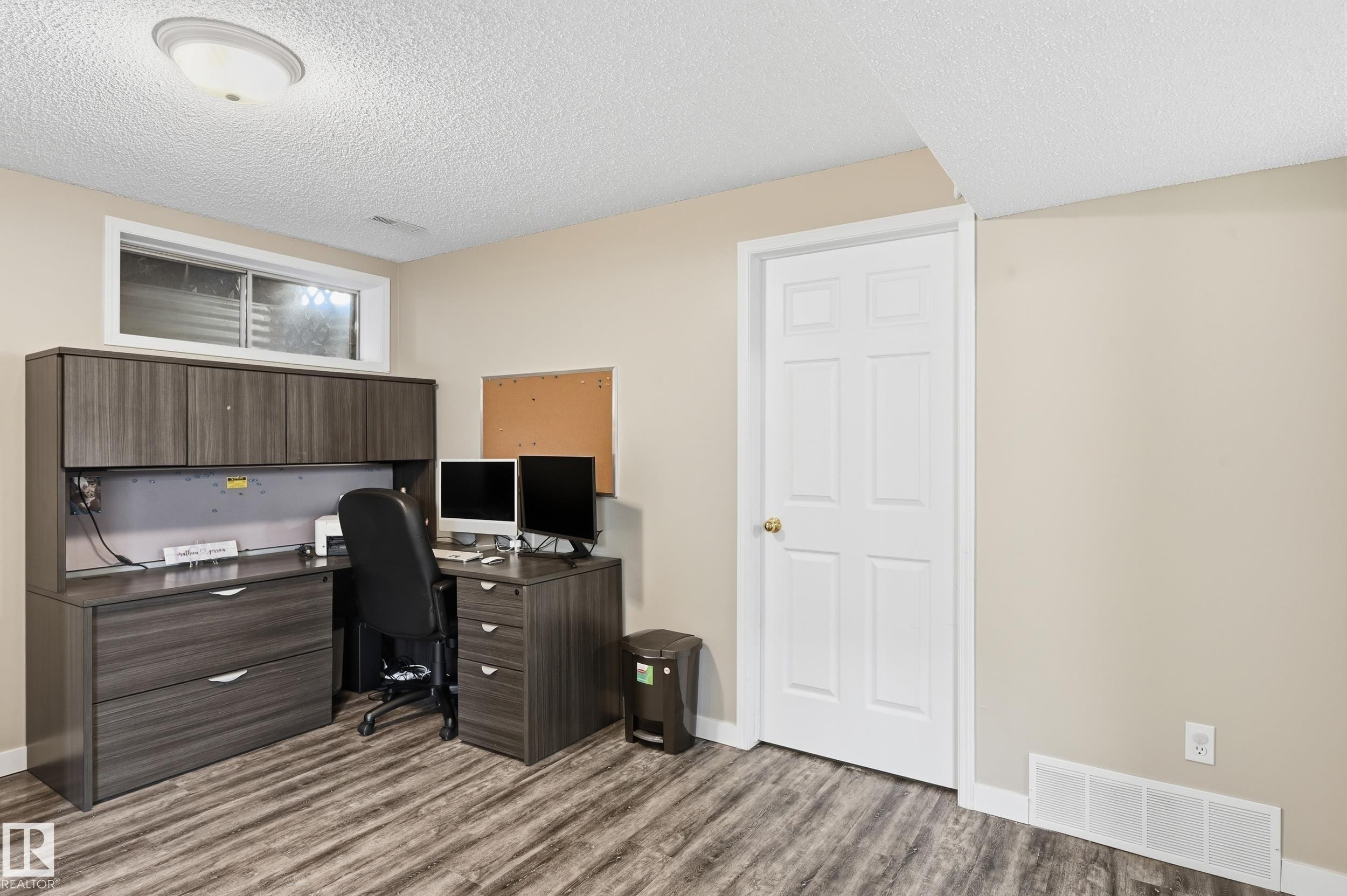 Home office featuring a textured ceiling and light wood-type flooring - 2952 39 Avenue, Edmonton, AB - Indoor