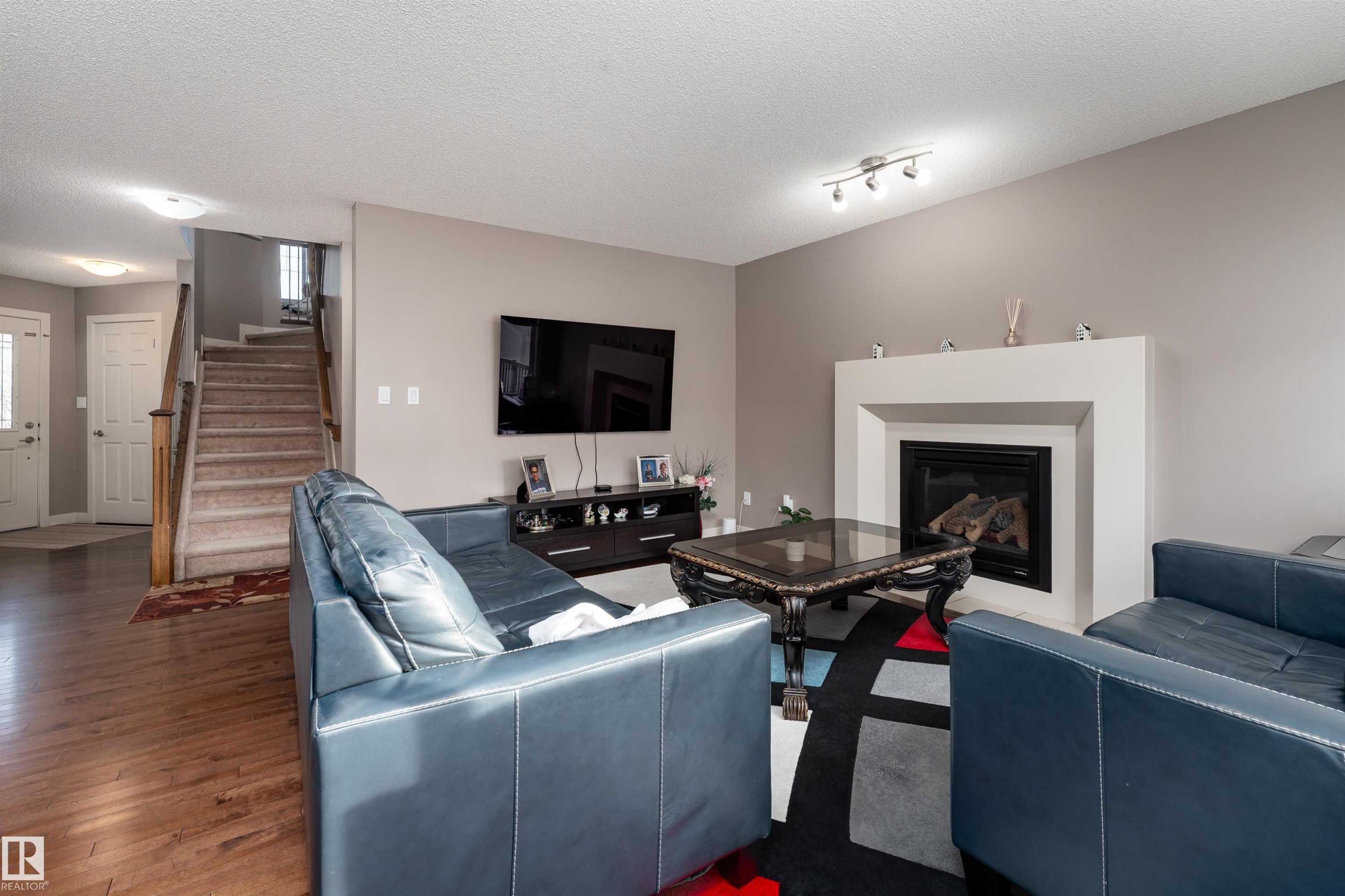 6811 19 Avenue, Edmonton, AB - Indoor Photo Showing Living Room With Fireplace