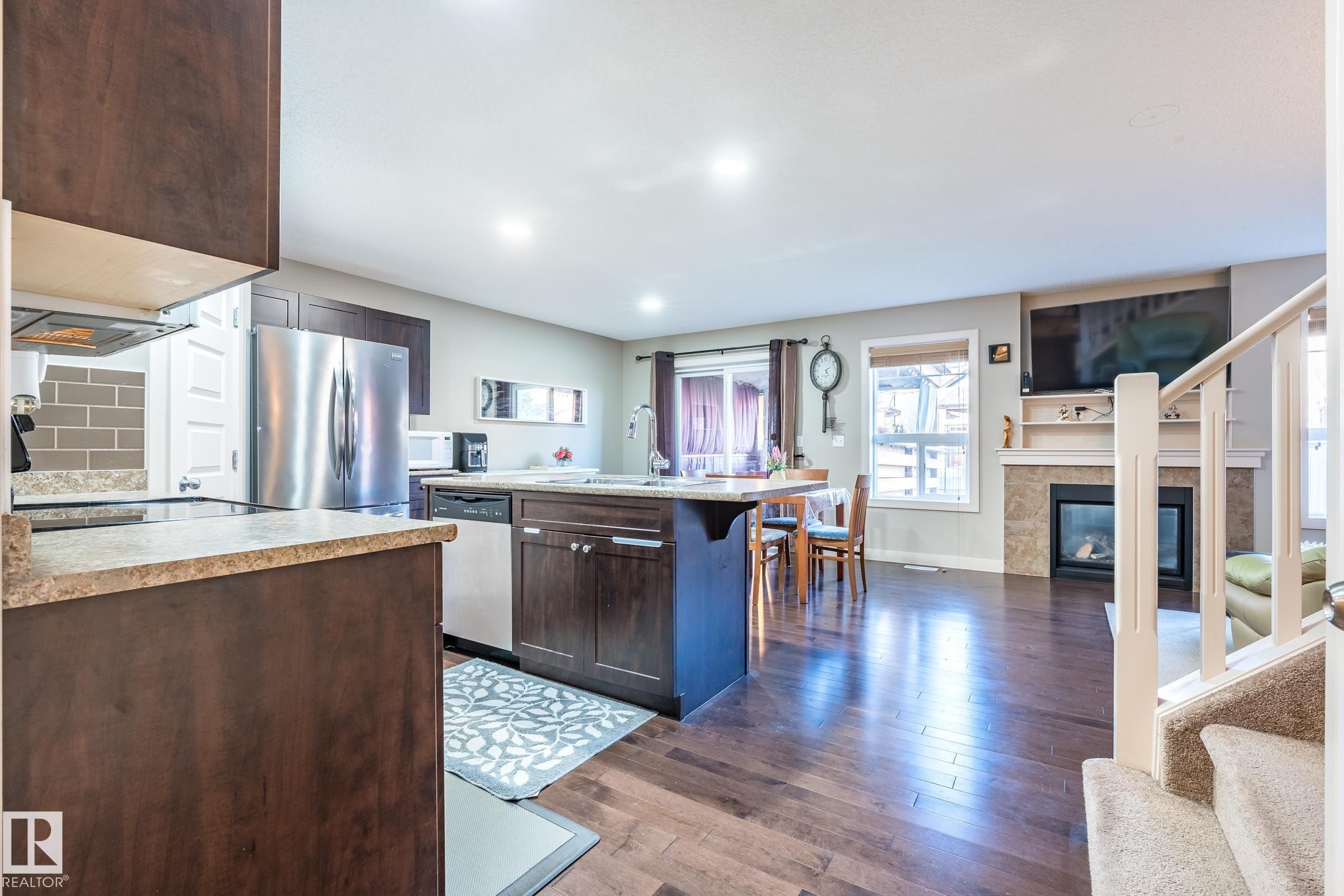 1692 Cunningham Way, Edmonton, AB - Indoor Photo Showing Kitchen With Fireplace