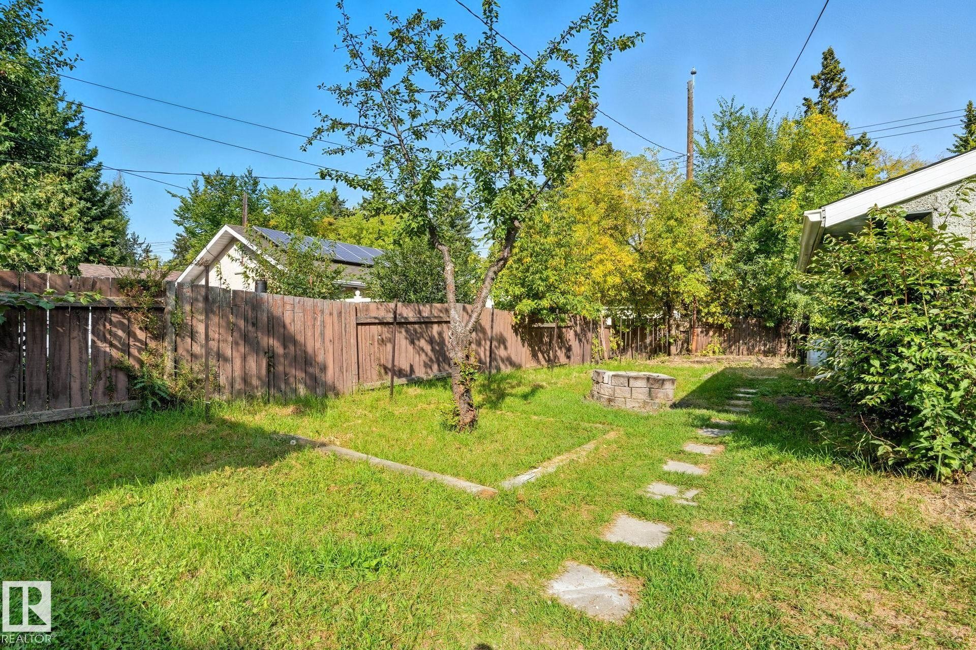 Fenced backyard featuring a fire pit - 11222 71 Avenue, Edmonton, AB - Outdoor