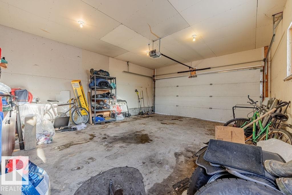 Garage featuring a garage door opener - 12253 95A Street, Edmonton, AB - Indoor Photo Showing Garage