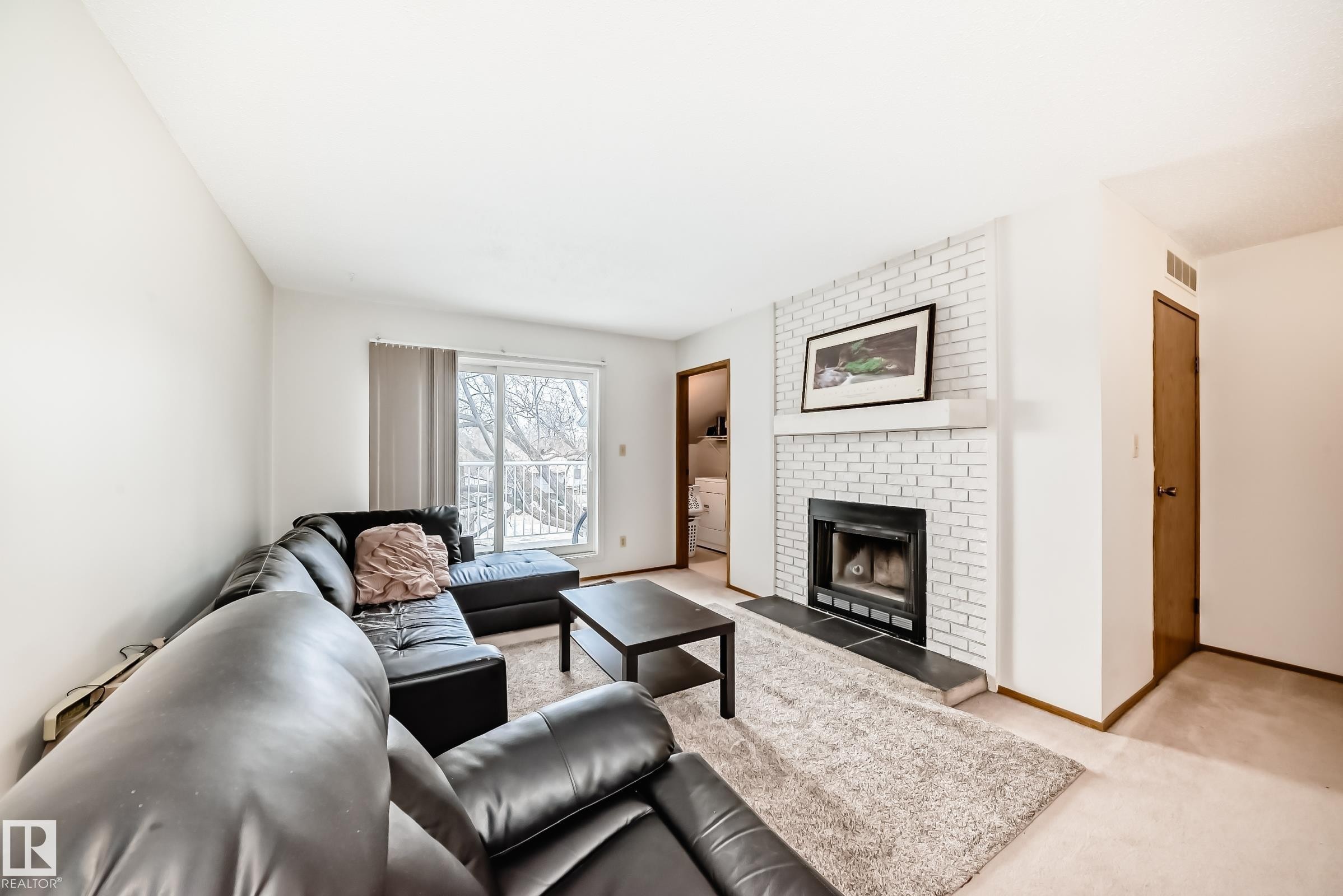 307 60 Alpine Place, St. Albert, AB - Indoor Photo Showing Living Room With Fireplace