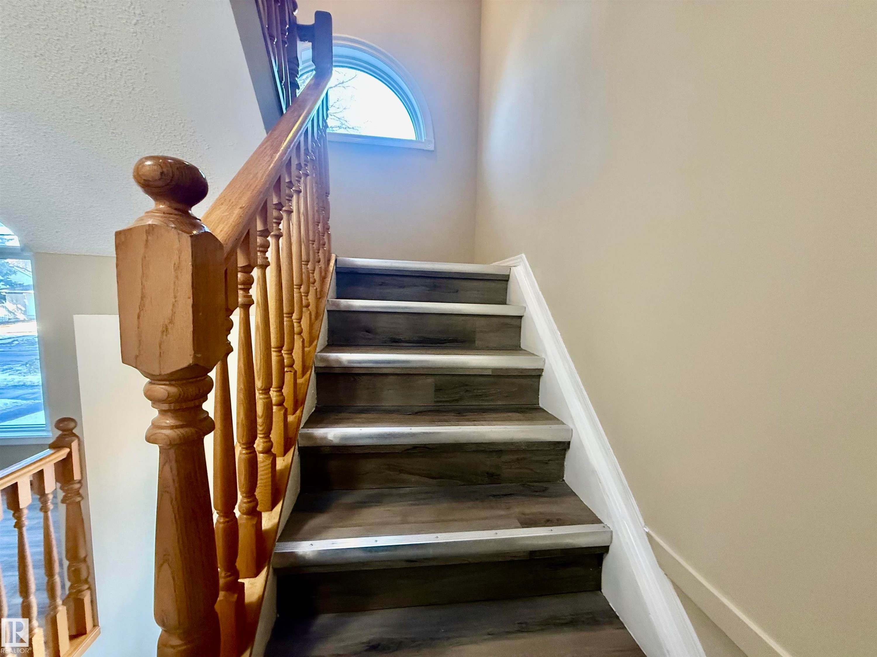 Staircase featuring wood finished floors - 10905 74 Avenue, Edmonton, AB - Indoor Photo Showing Other Room