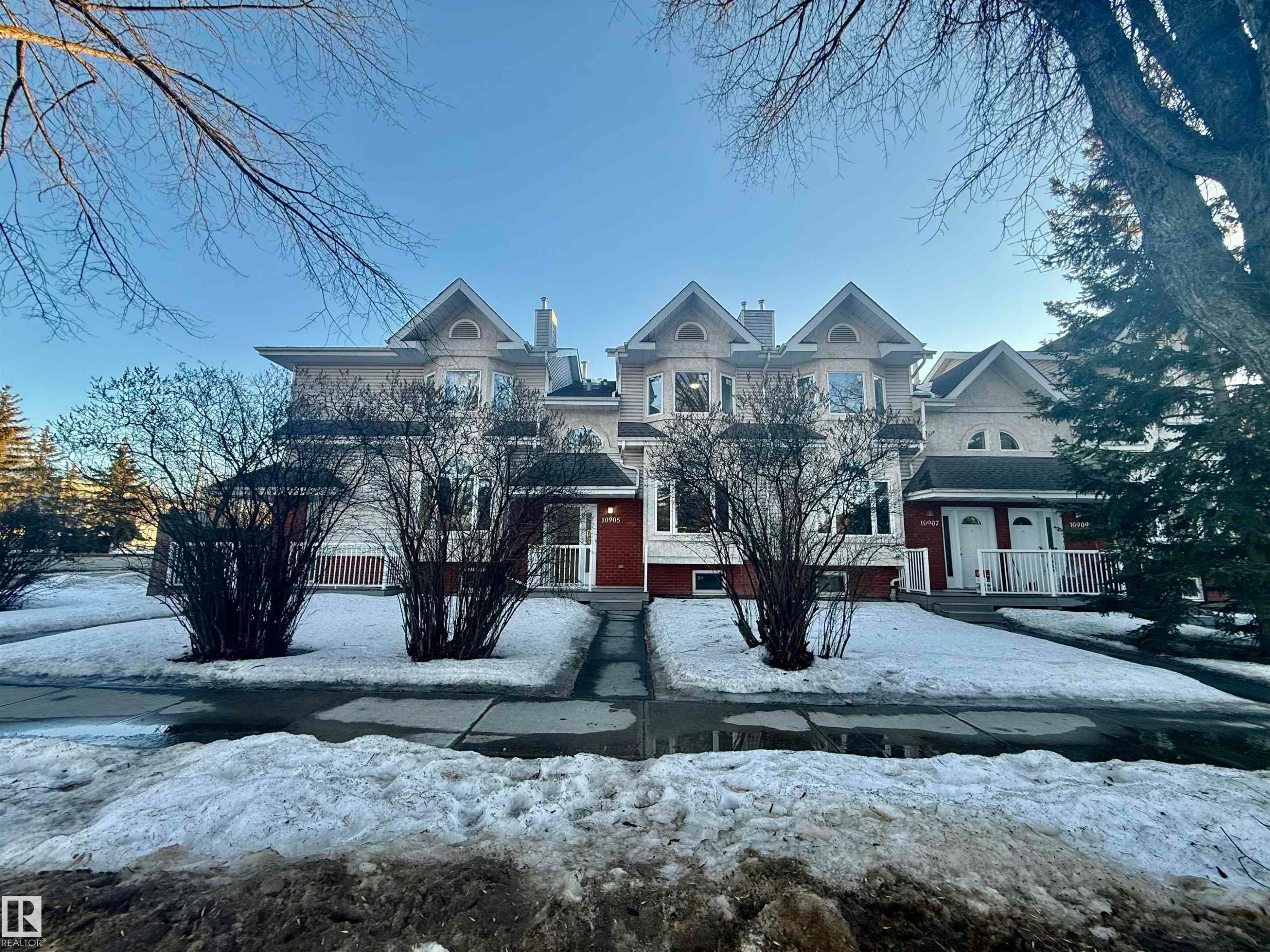 View of front of home with a chimney and brick siding - 10905 74 Avenue, Edmonton, AB - Outdoor With Facade