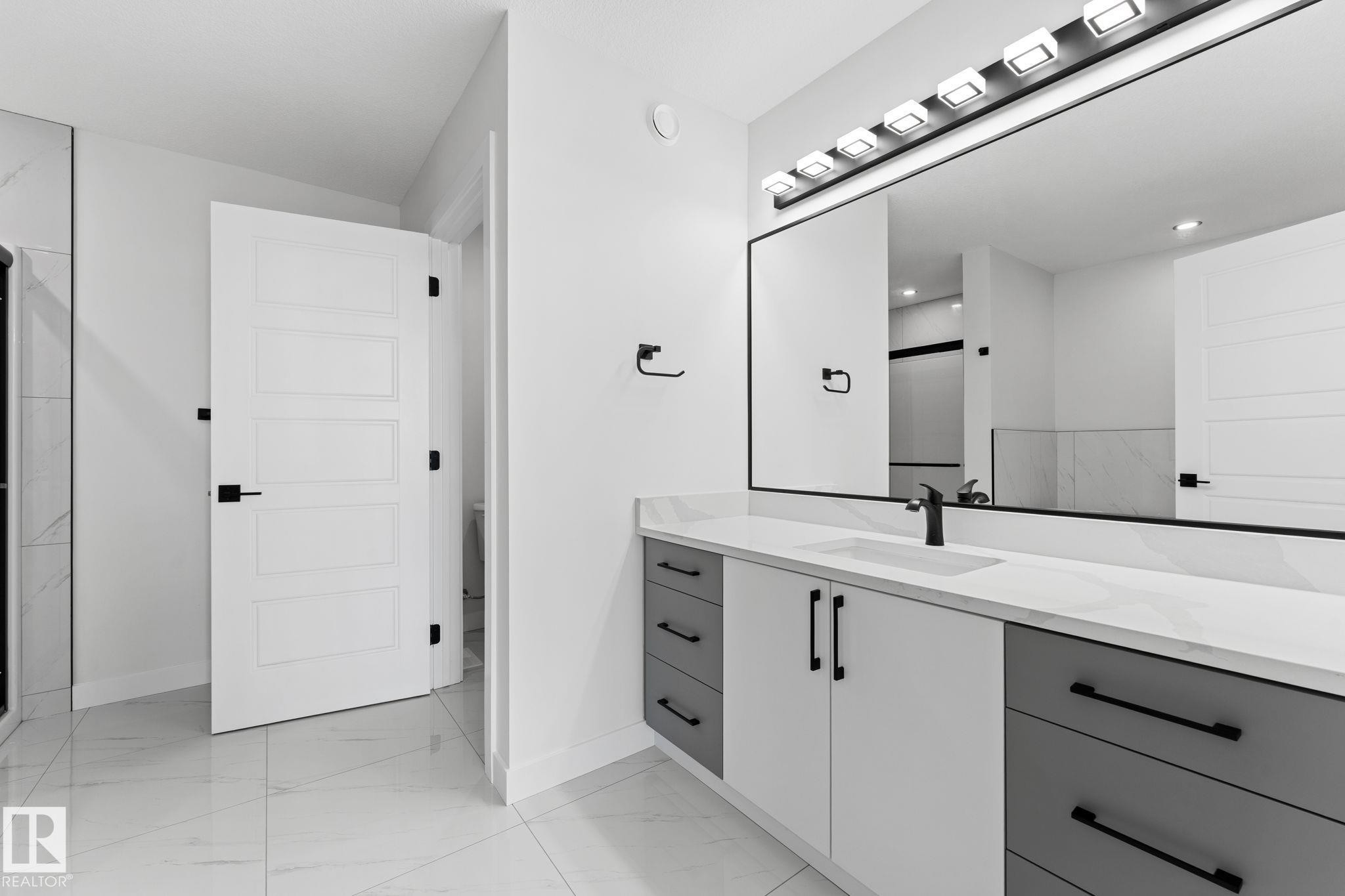 Full bathroom with vanity, a shower stall, and light marble finish flooring - 3 Pierwyck Loop, Spruce Grove, AB - Indoor