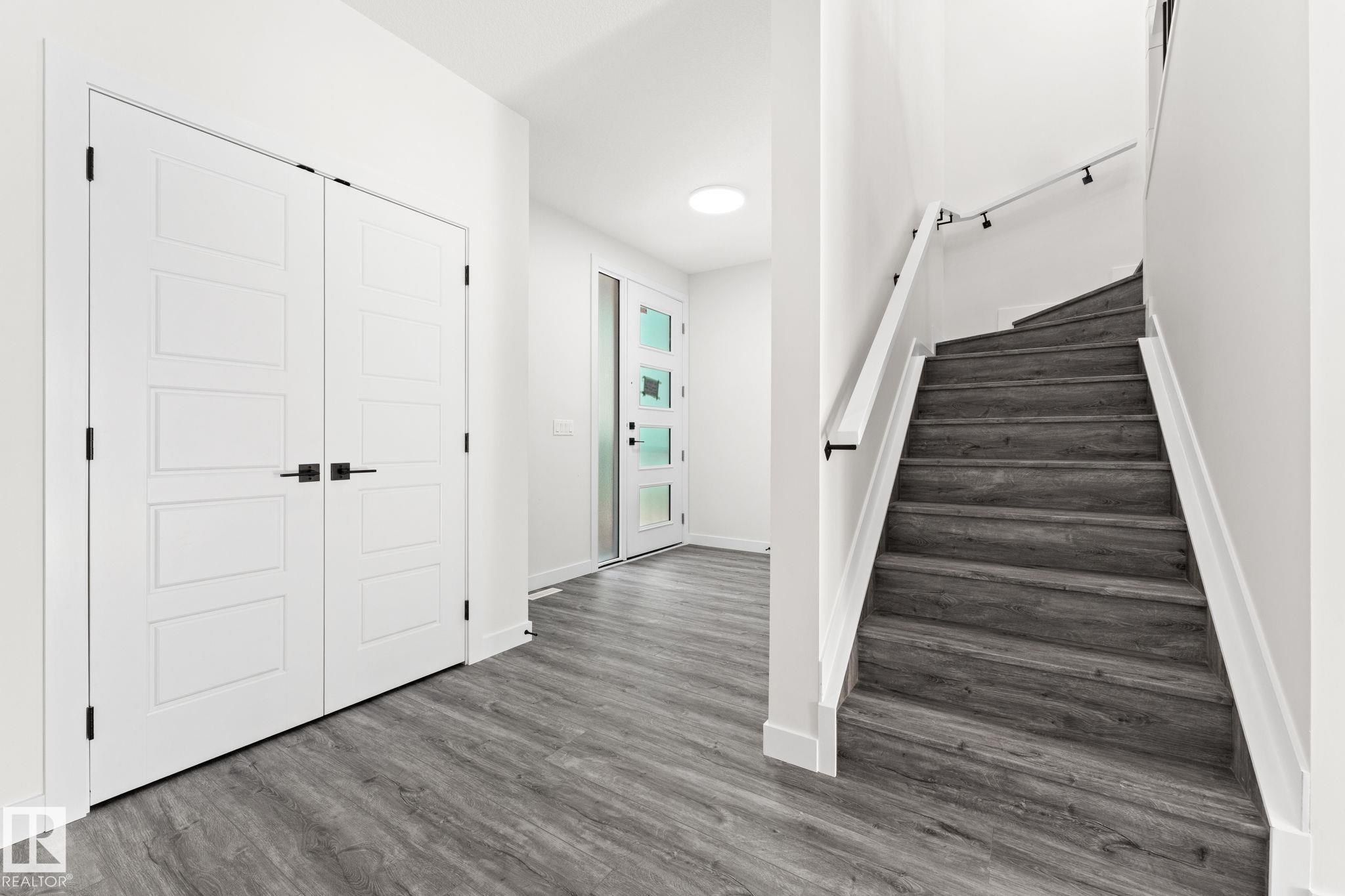 Stairway featuring wood finished floors - 3 Pierwyck Loop, Spruce Grove, AB - Indoor Photo Showing Other Room