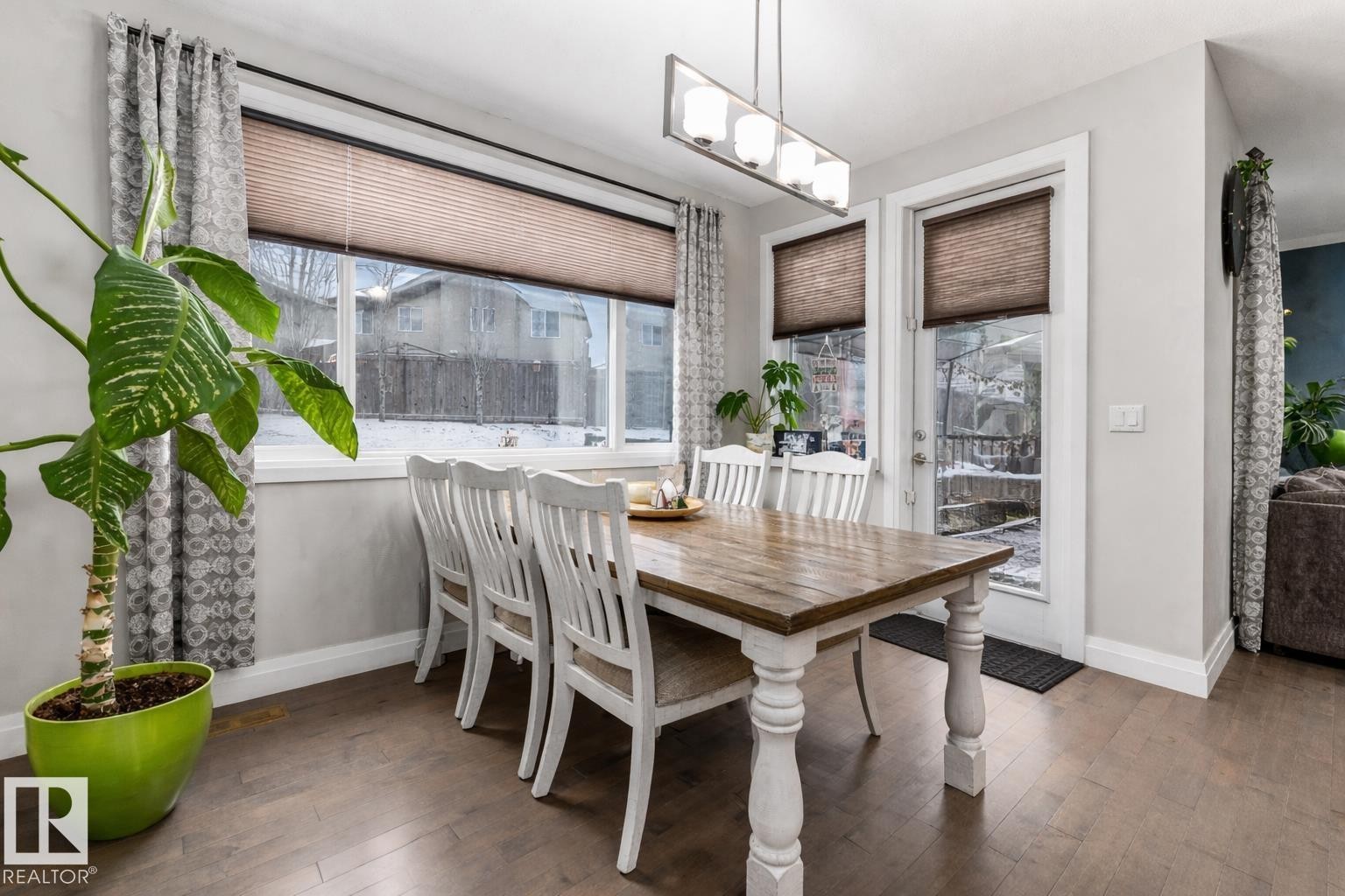 Dining room with dark wood-type flooring - 14 Spring Bay, Spruce Grove, AB - Indoor Photo Showing Dining Room