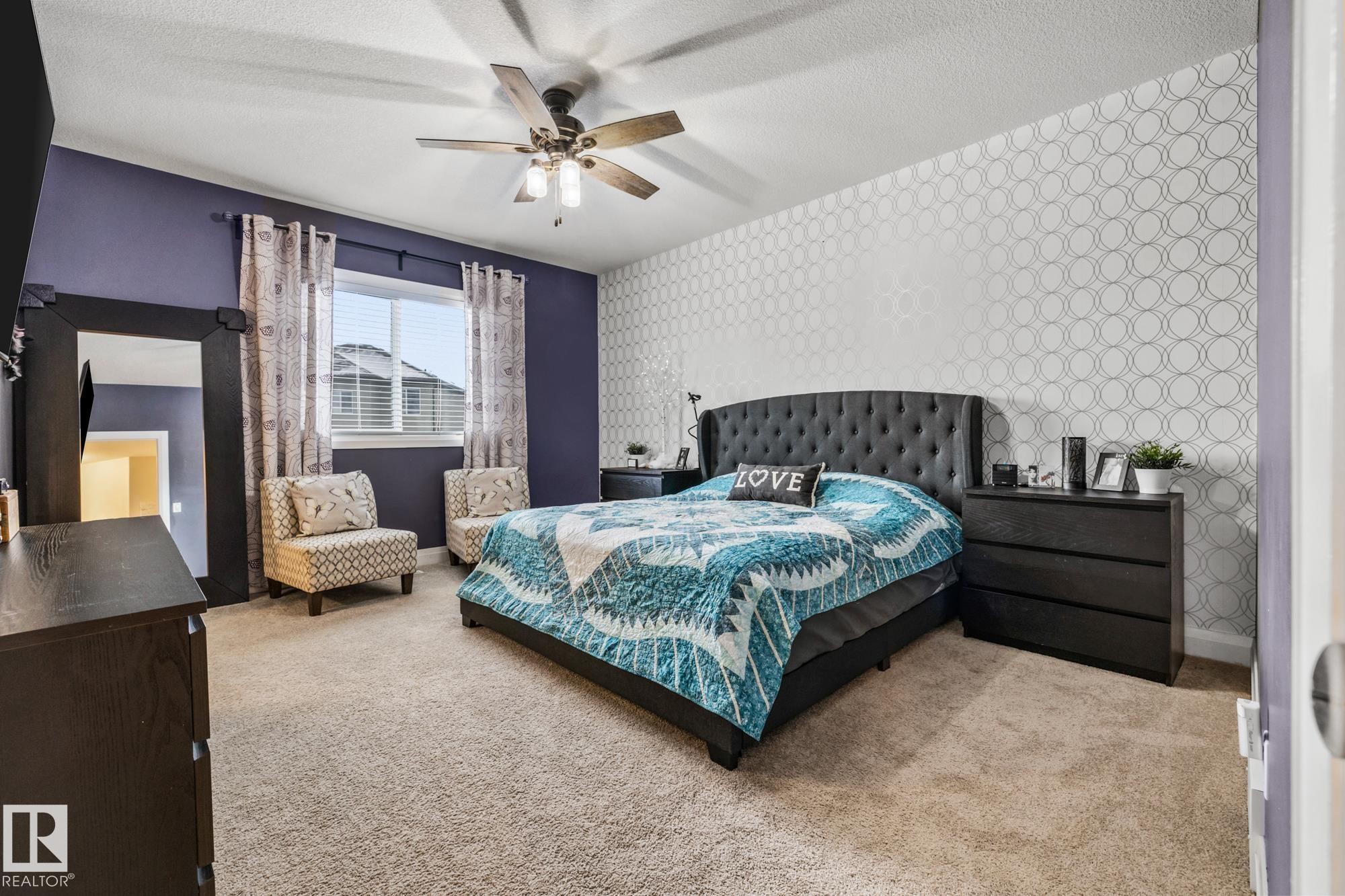 Bedroom with wallpapered walls, carpet, a textured ceiling, and a ceiling fan - 14 Spring Bay, Spruce Grove, AB - Indoor Photo Showing Bedroom