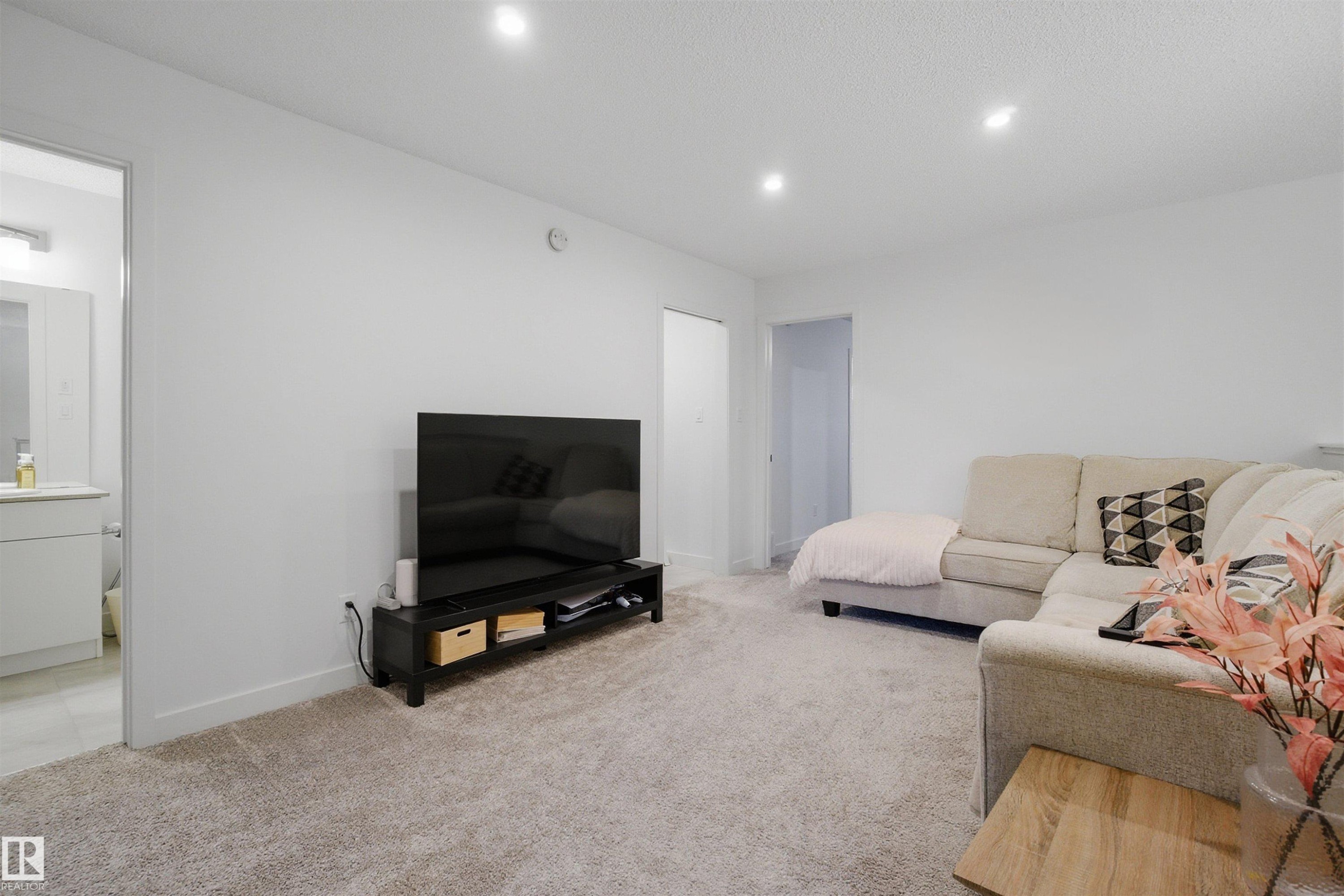 Living room featuring light carpet and recessed lighting - 9882 225A St Nw, Edmonton, AB - Indoor Photo Showing Living Room