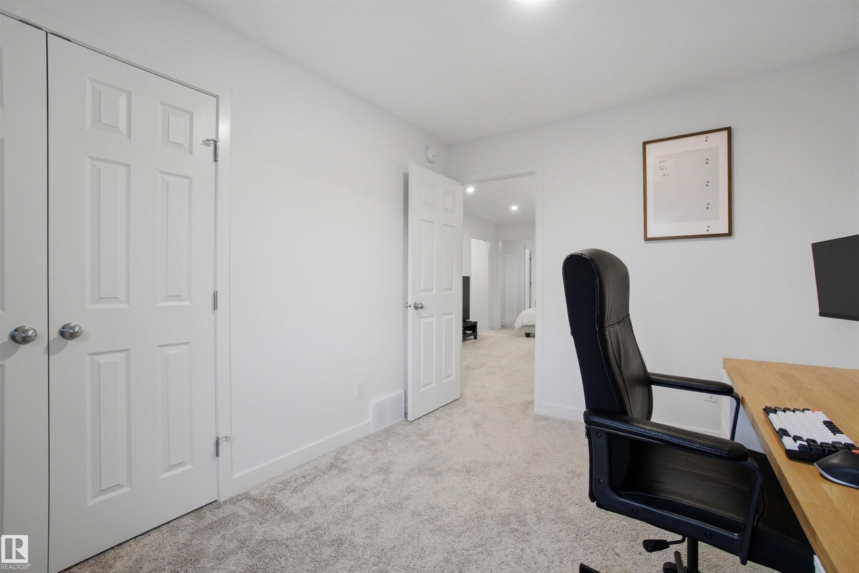 Home office featuring light colored carpet and baseboards - 9882 225A St Nw, Edmonton, AB - Indoor Photo Showing Office