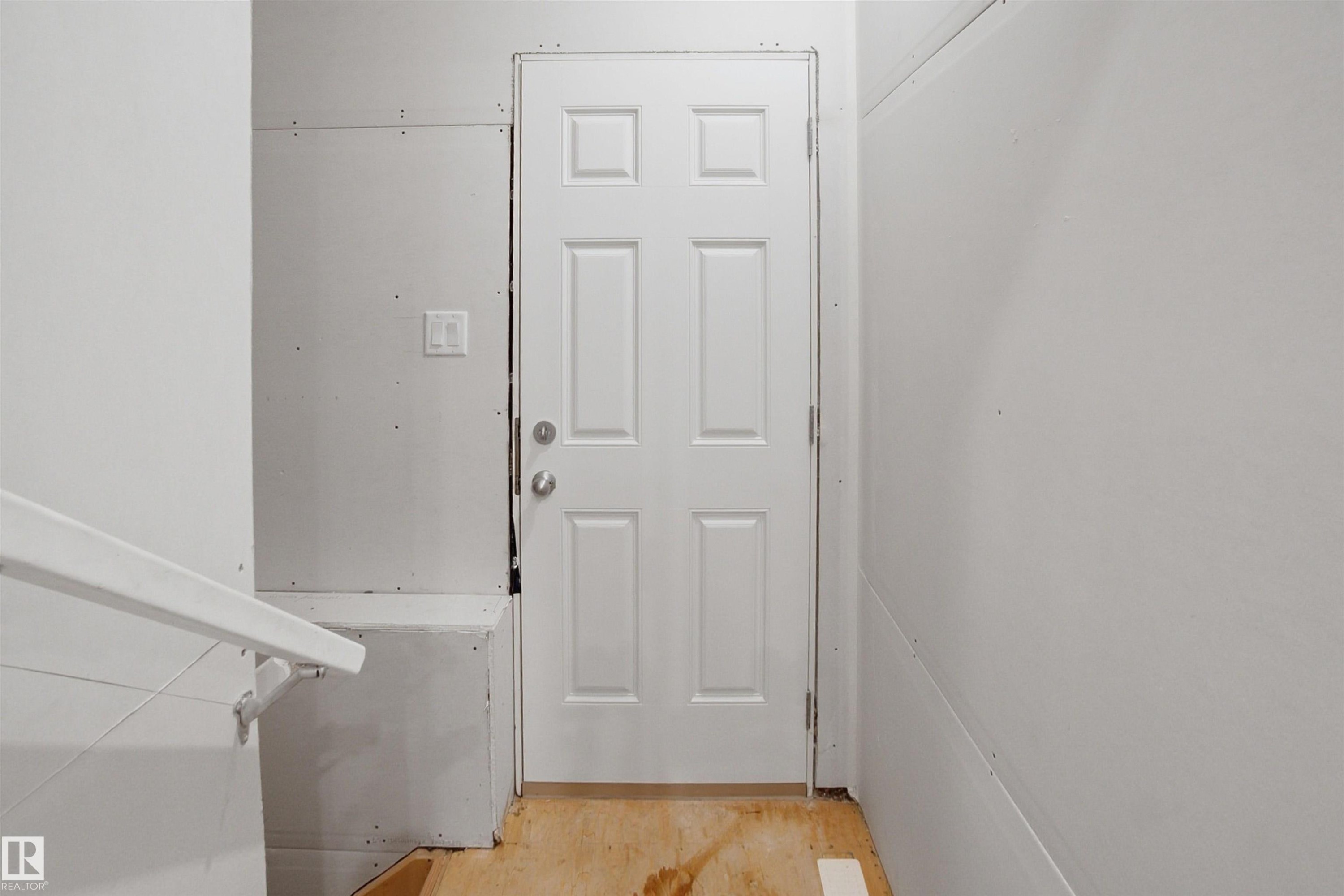 Doorway to outside with wood finished floors - 9882 225A St Nw, Edmonton, AB - Indoor Photo Showing Other Room