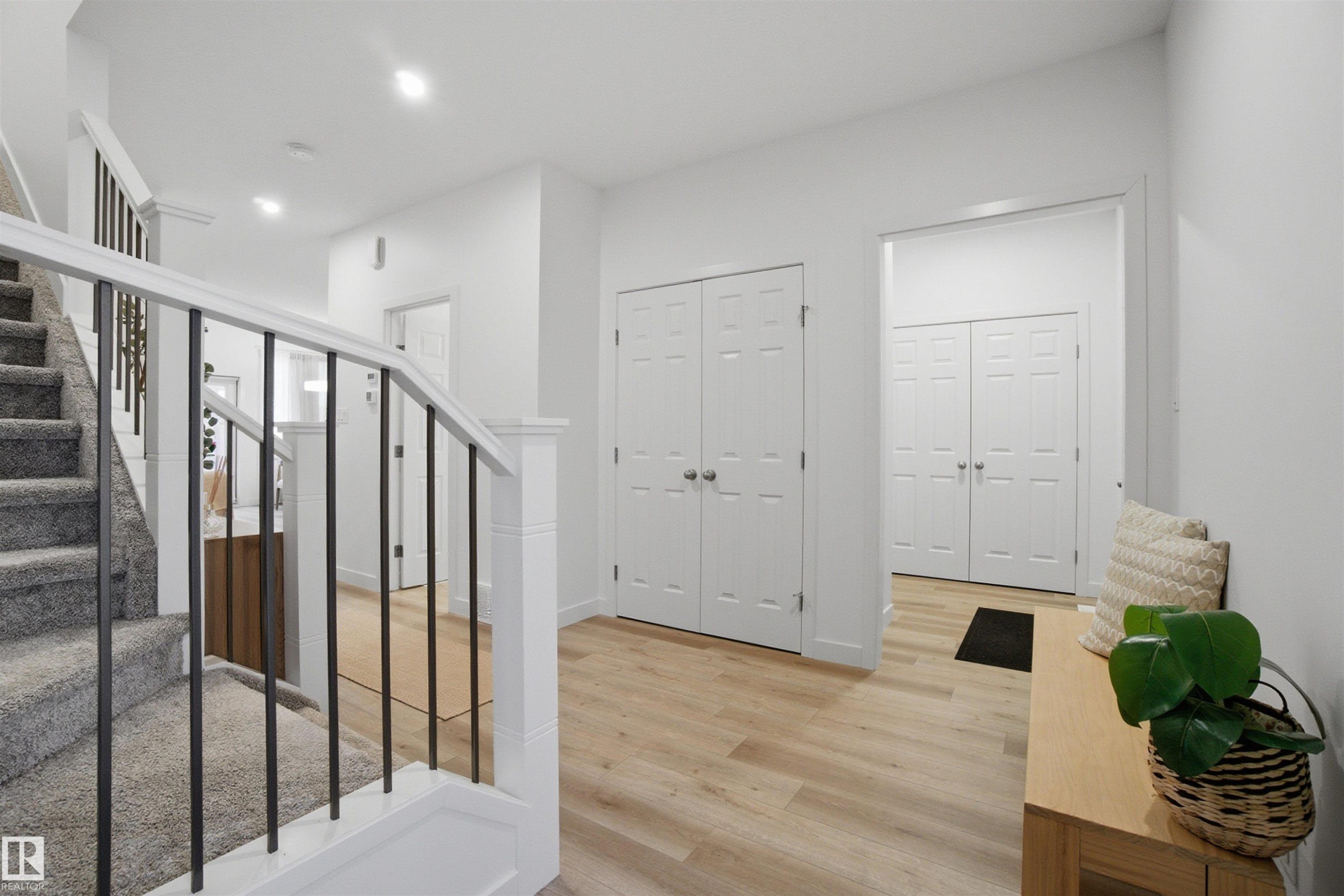 Stairs featuring wood finished floors and recessed lighting - 9882 225A St Nw, Edmonton, AB - Indoor Photo Showing Other Room