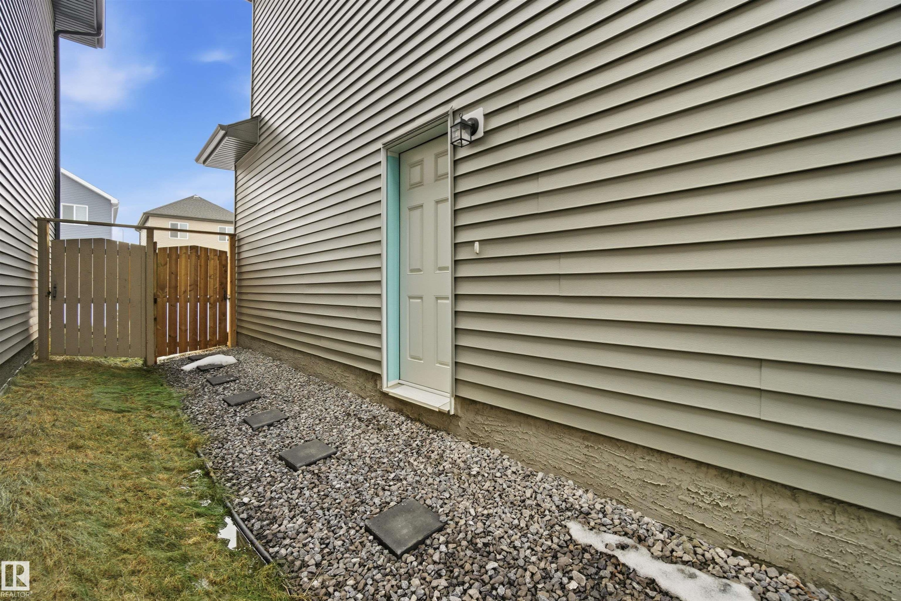 View of side of home with a gate - 9882 225A St Nw, Edmonton, AB - Outdoor