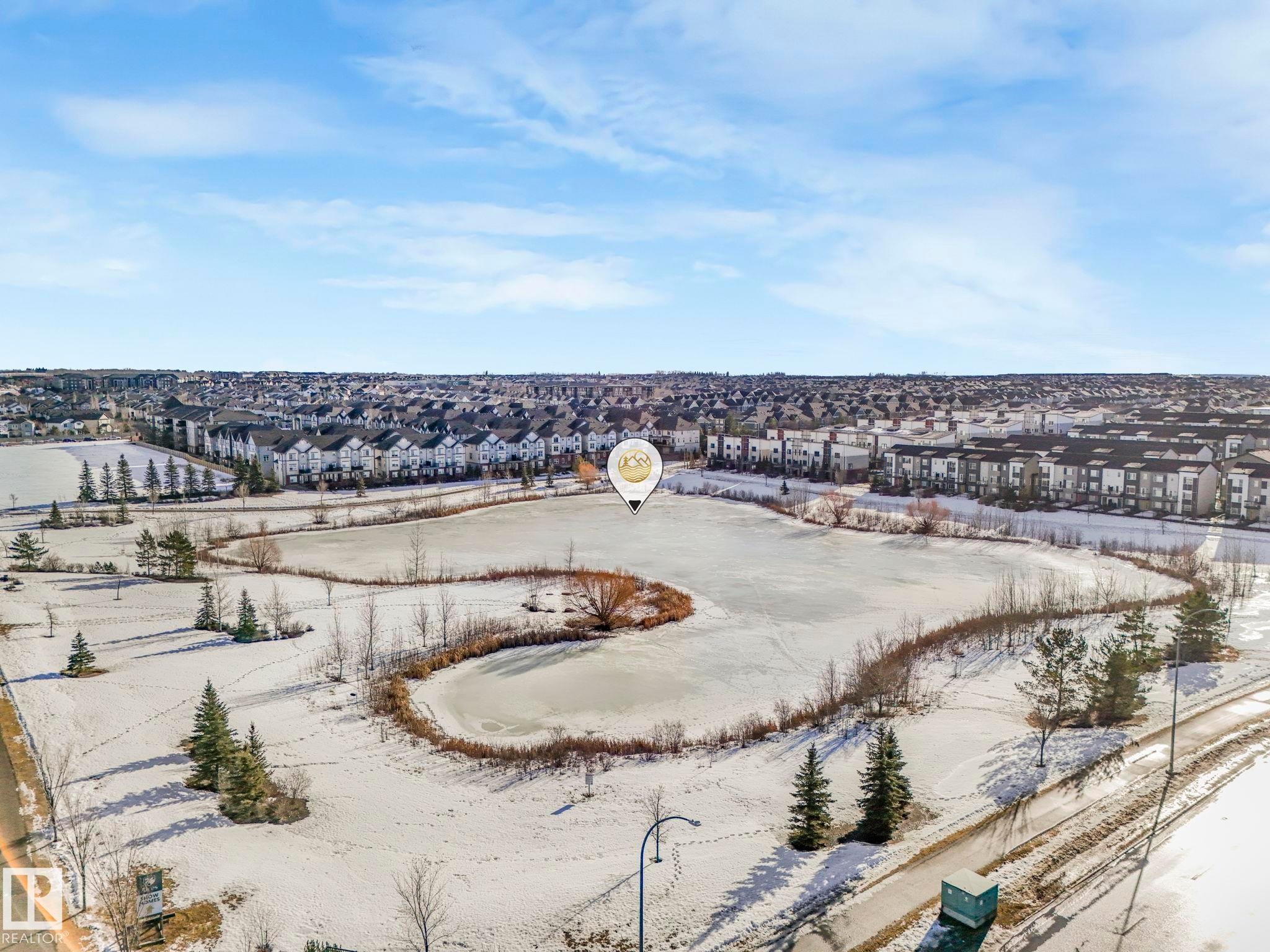 Snowy aerial view with a residential view - 91 603 Watt Boulevard, Edmonton, AB - Outdoor With View
