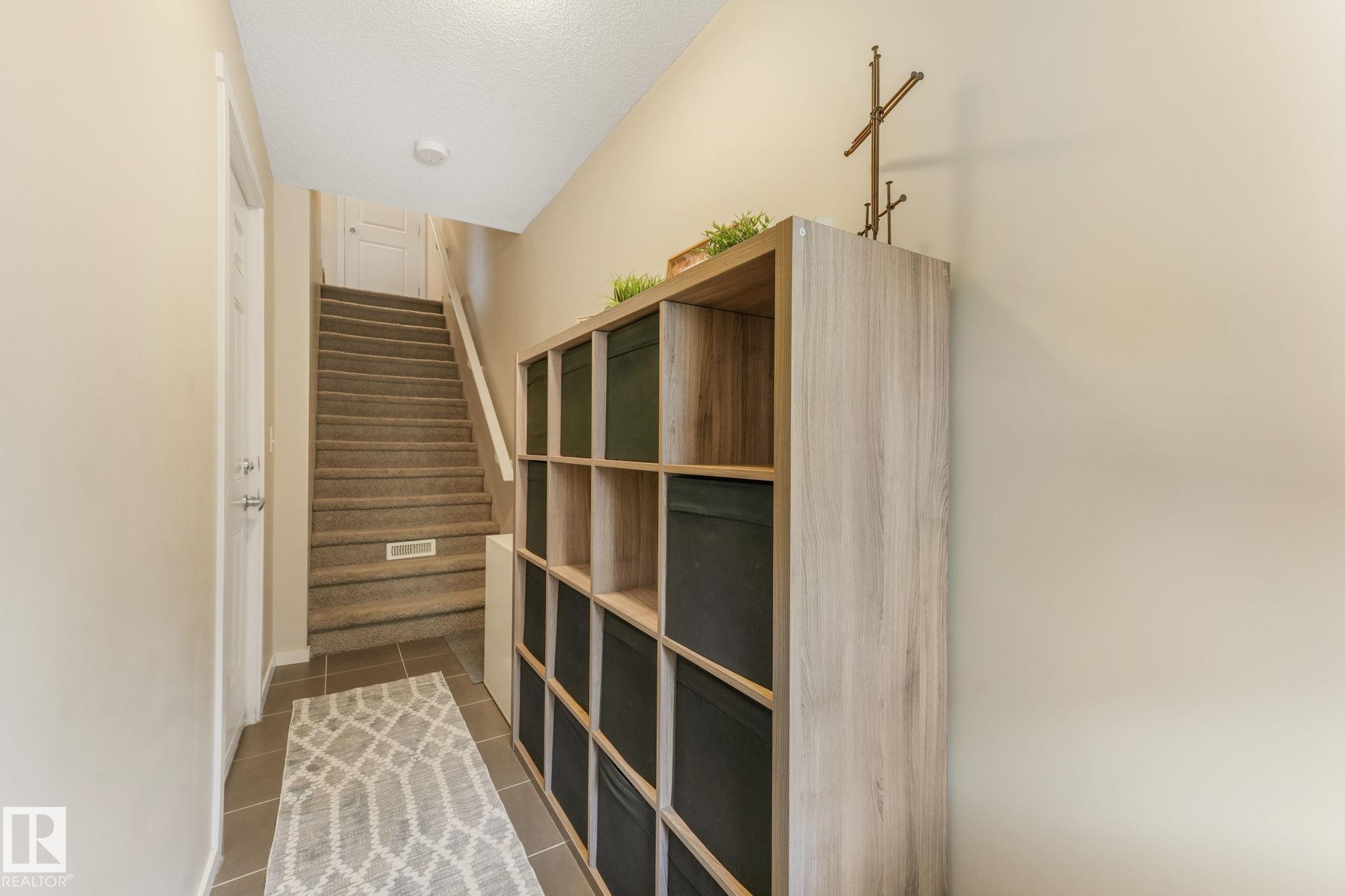 Interior space featuring a textured ceiling and baseboards - 91 603 Watt Boulevard, Edmonton, AB - Indoor Photo Showing Other Room