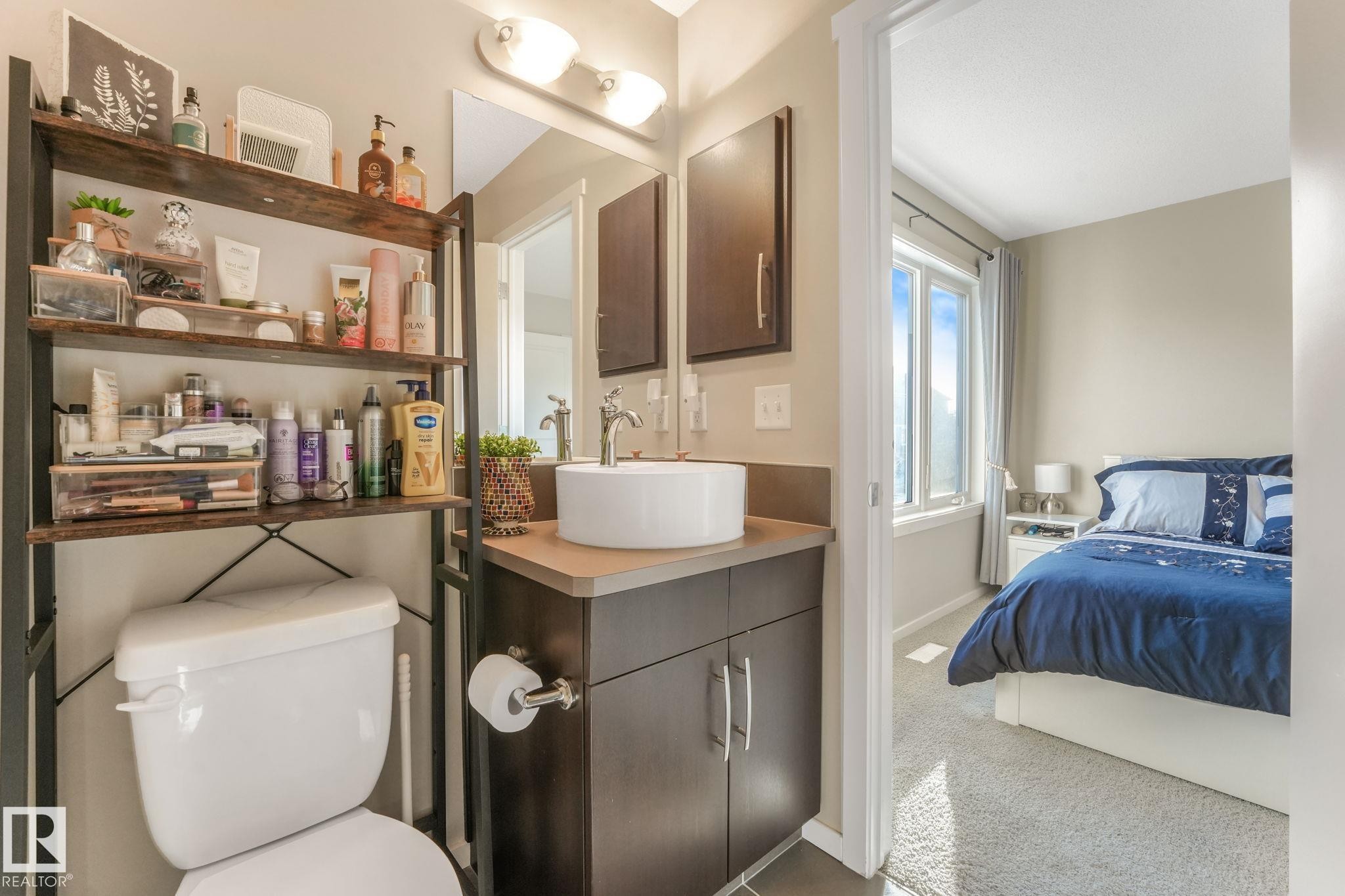Ensuite bathroom with vanity and light colored carpet - 91 603 Watt Boulevard, Edmonton, AB - Indoor