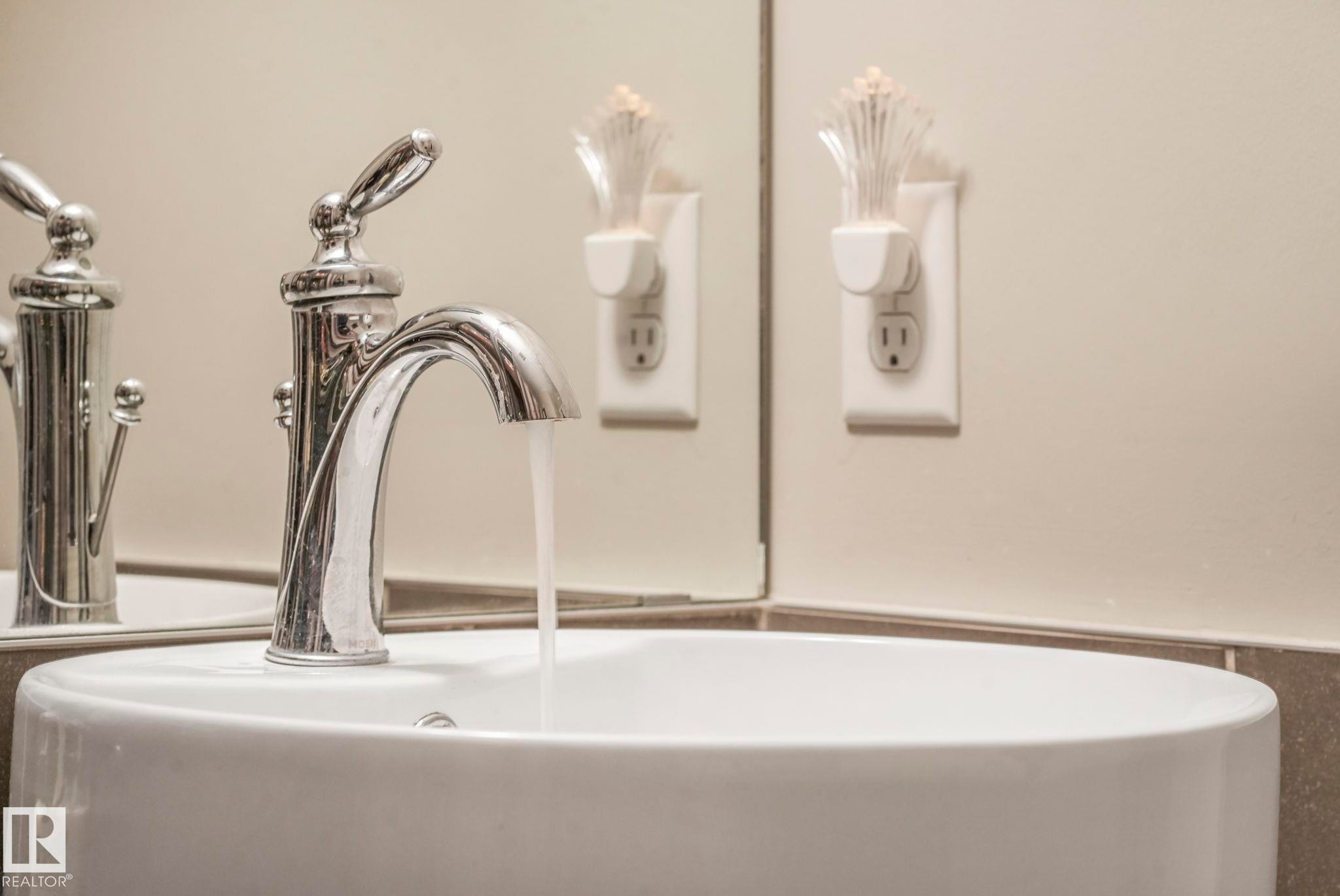 Bathroom view of a sink and a wainscoted wall - 91 603 Watt Boulevard, Edmonton, AB - Indoor