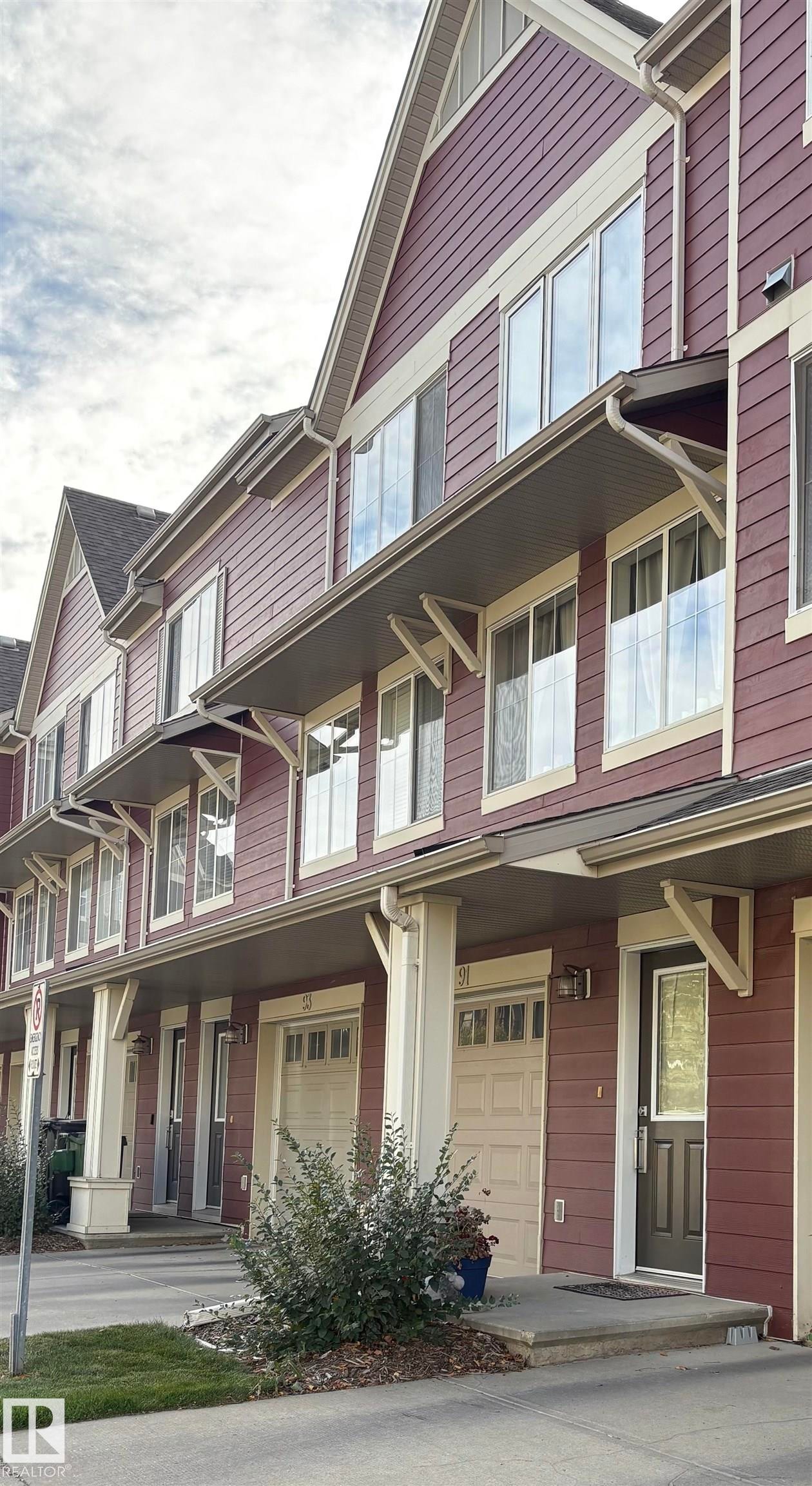 View of front of home featuring covered porch and a garage - 91 603 Watt Boulevard, Edmonton, AB - Outdoor With Facade