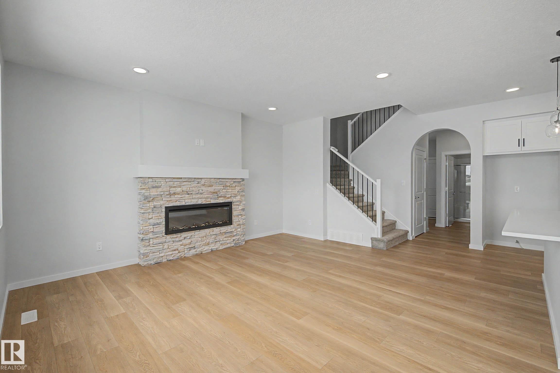 5433 Hawthorn Run, Edmonton, AB - Indoor Photo Showing Living Room With Fireplace