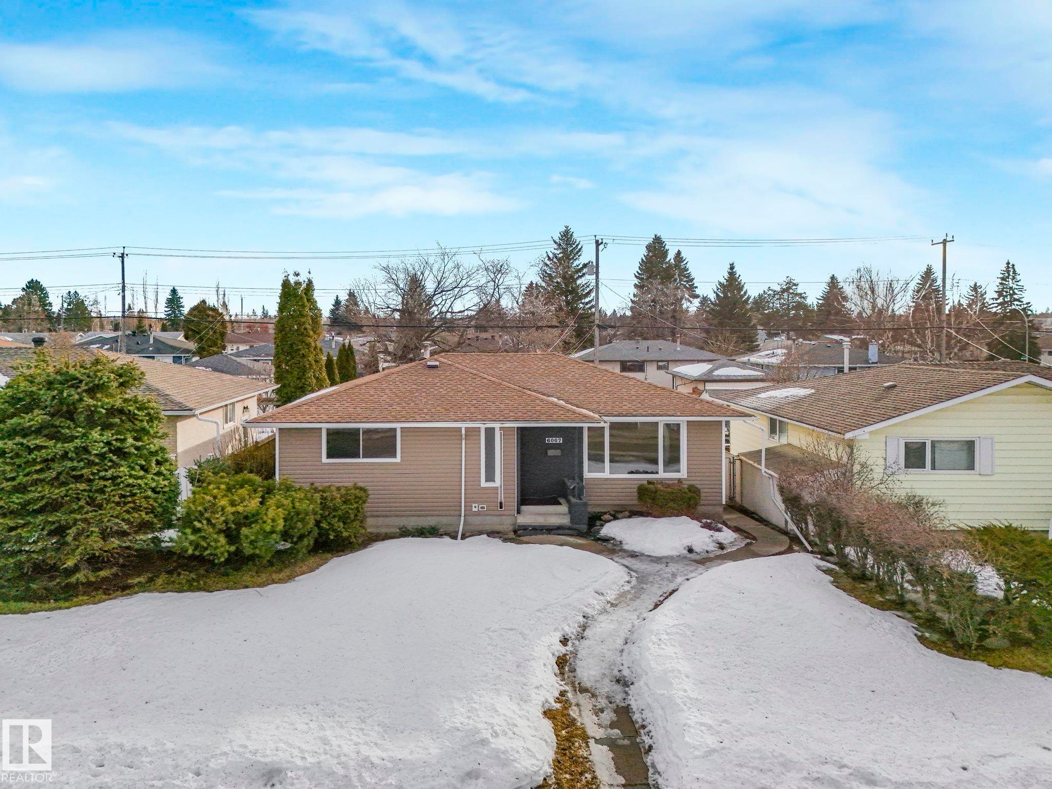 Ranch-style house featuring a residential view and a shingled roof - 6007 95 Avenue, Edmonton, AB - Outdoor