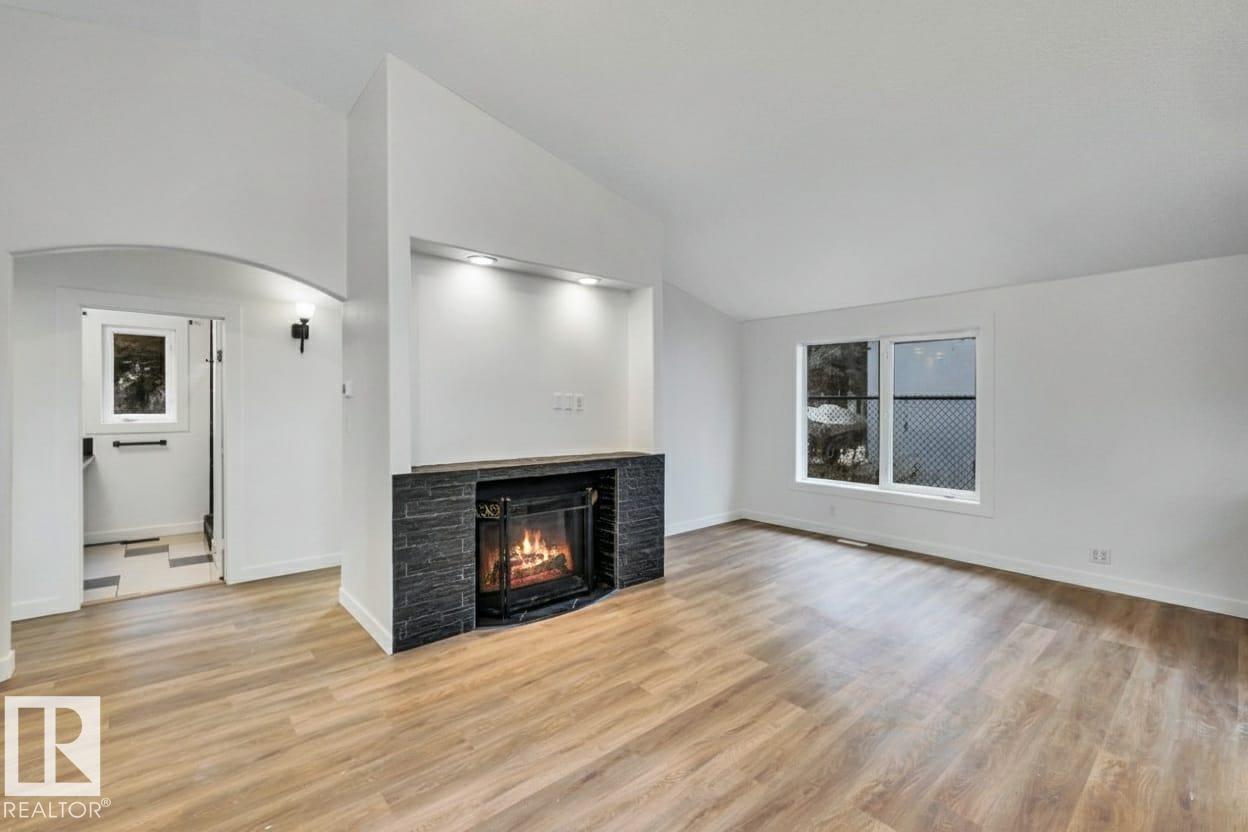 5220 47A Avenue, Rural Lac Ste. Anne County, AB - Indoor Photo Showing Living Room With Fireplace
