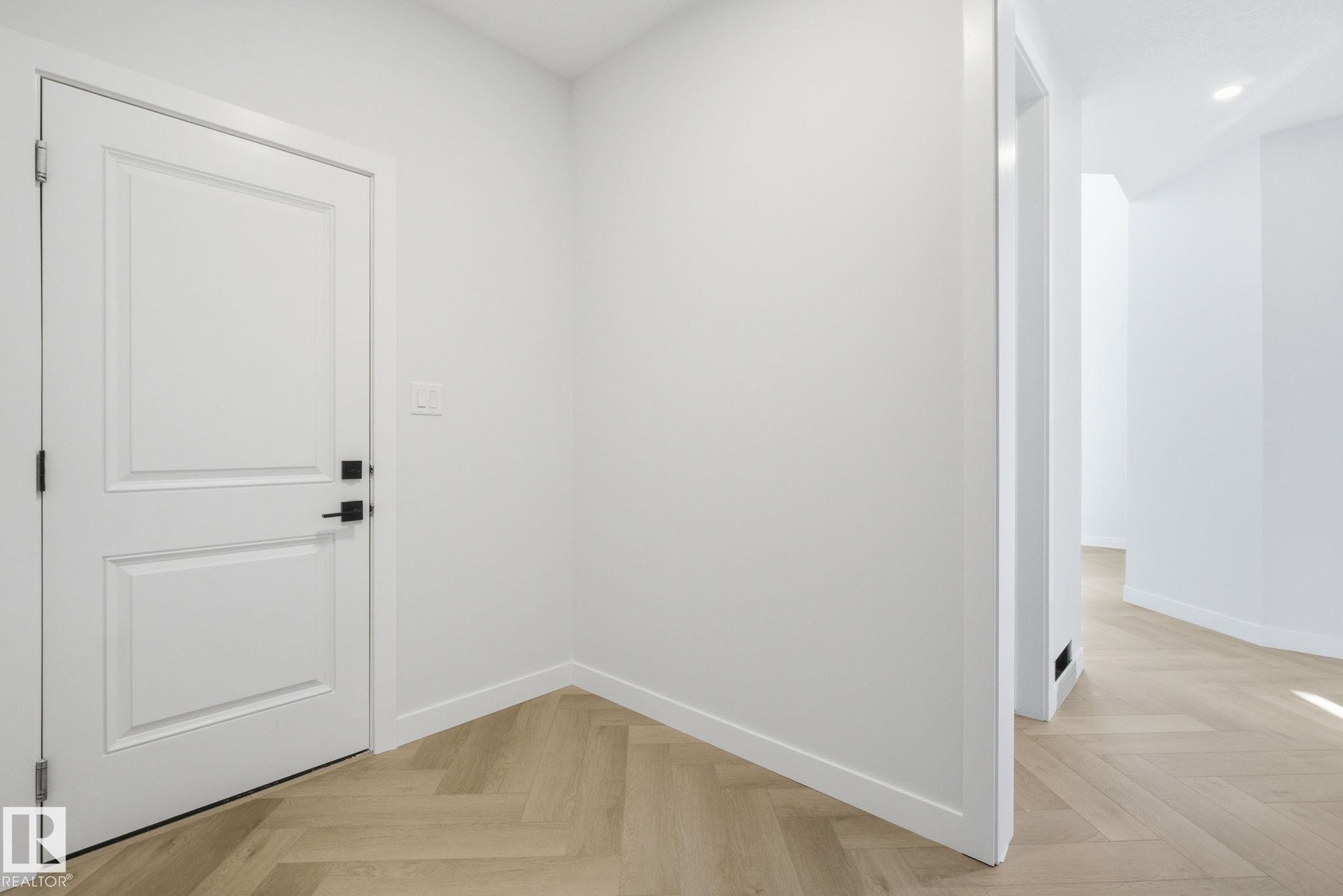 Interior space featuring parquet floors and recessed lighting - 17108 2 Street, Edmonton, AB - Indoor Photo Showing Other Room