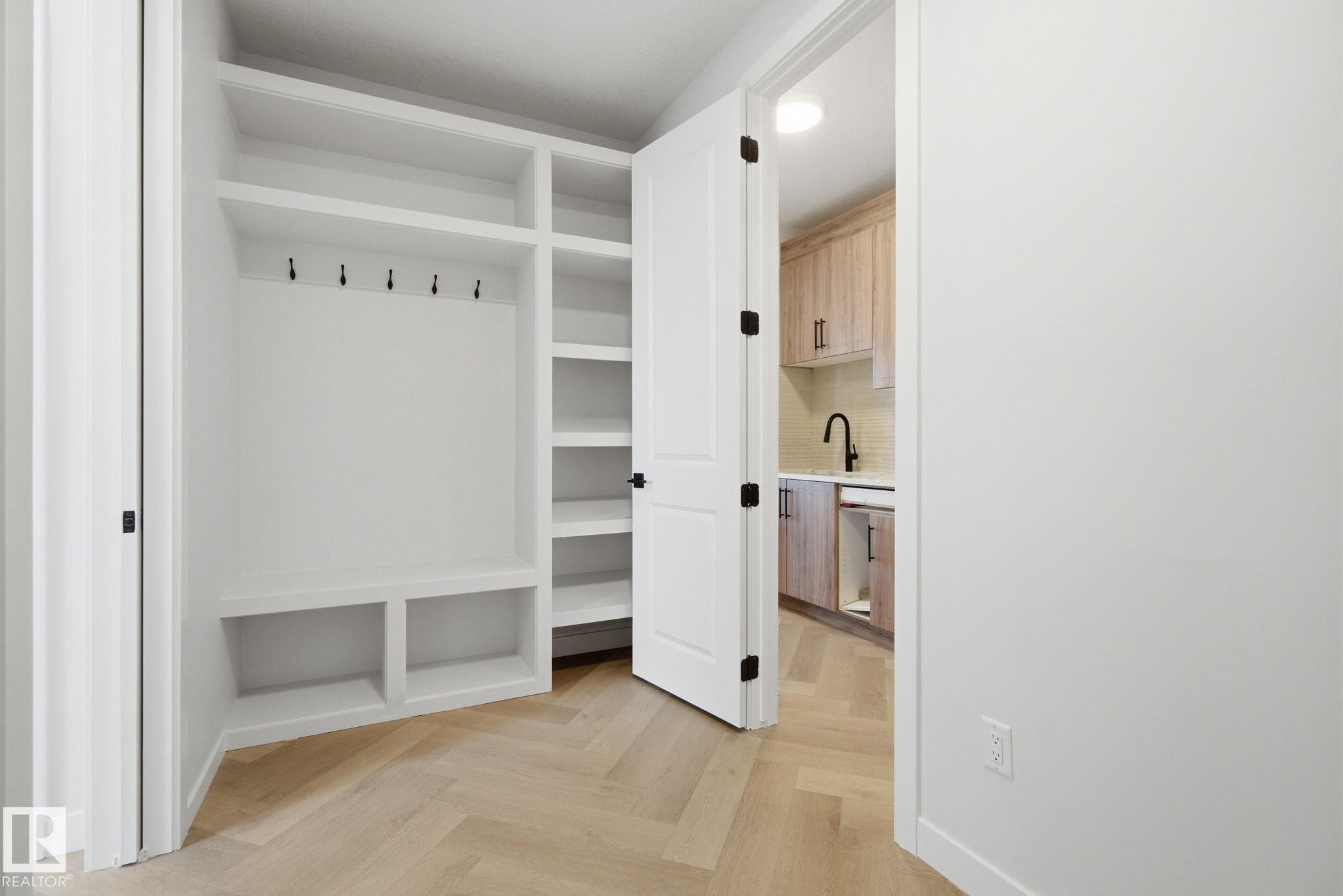 Mudroom featuring parquet flooring and a sink - 17108 2 Street, Edmonton, AB - Indoor