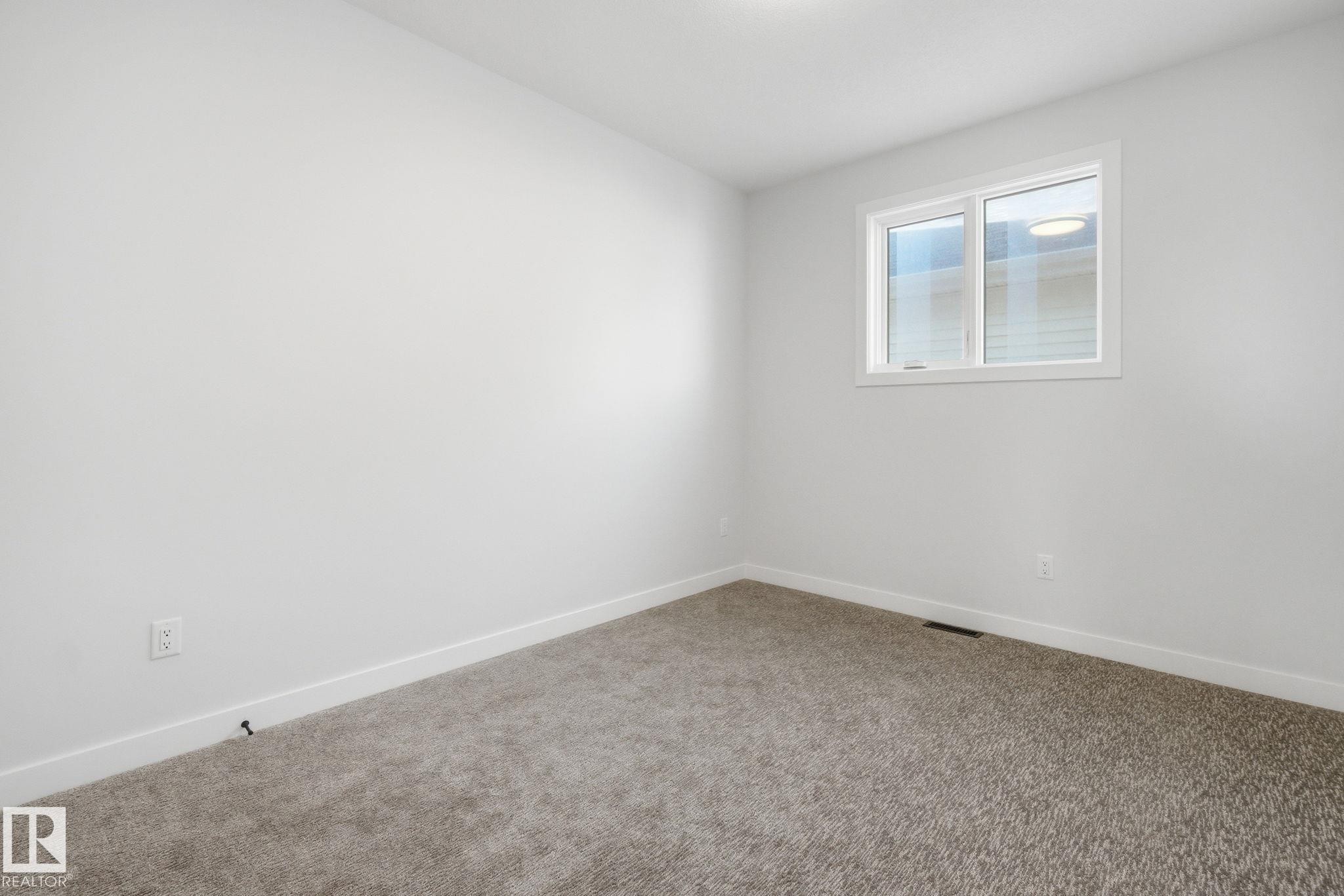 Empty room with baseboards and carpet floors - 17108 2 Street, Edmonton, AB - Indoor Photo Showing Other Room