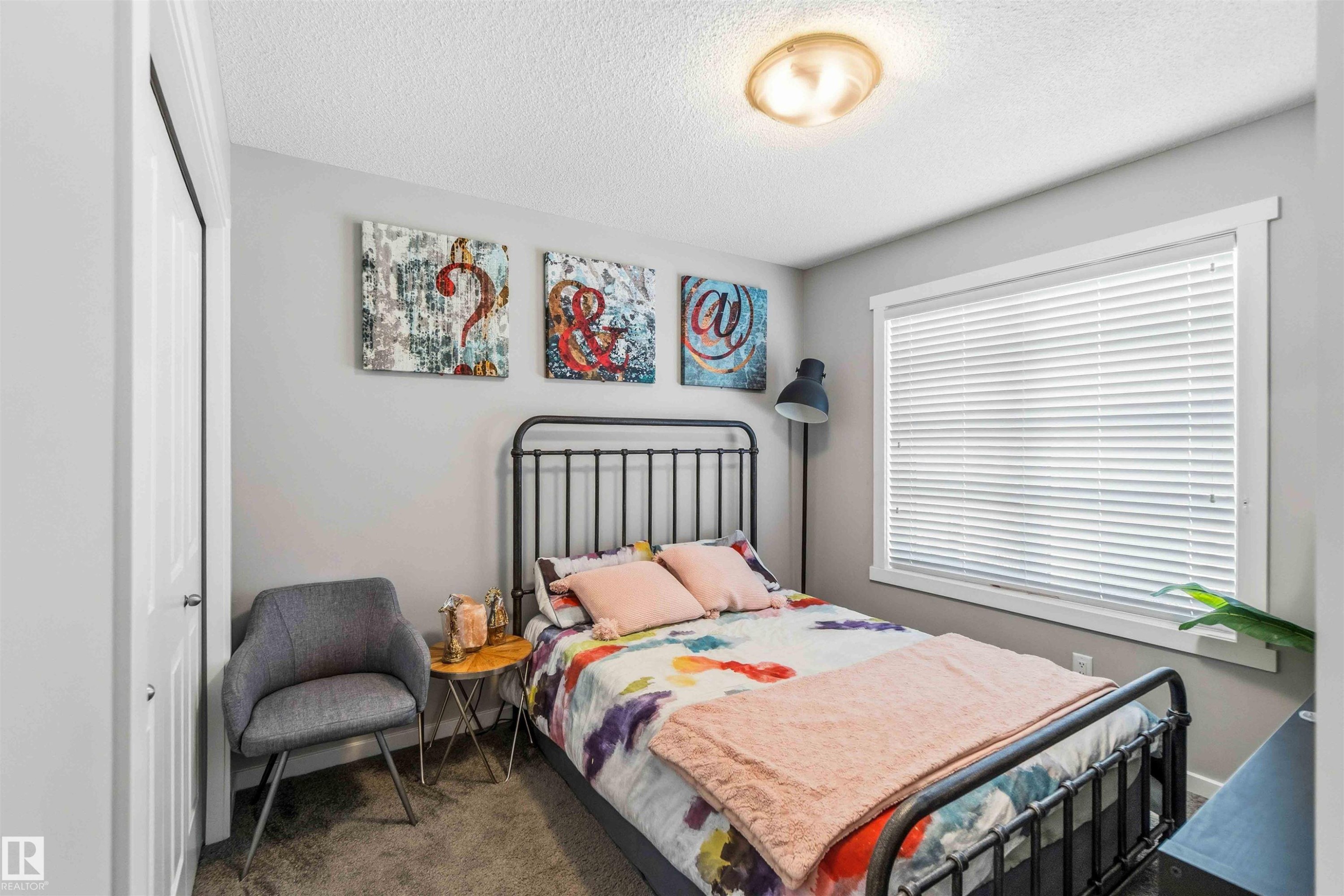 Bedroom featuring carpet floors, a textured ceiling, and a closet - 1908 25 Street, Edmonton, AB - Indoor Photo Showing Bedroom
