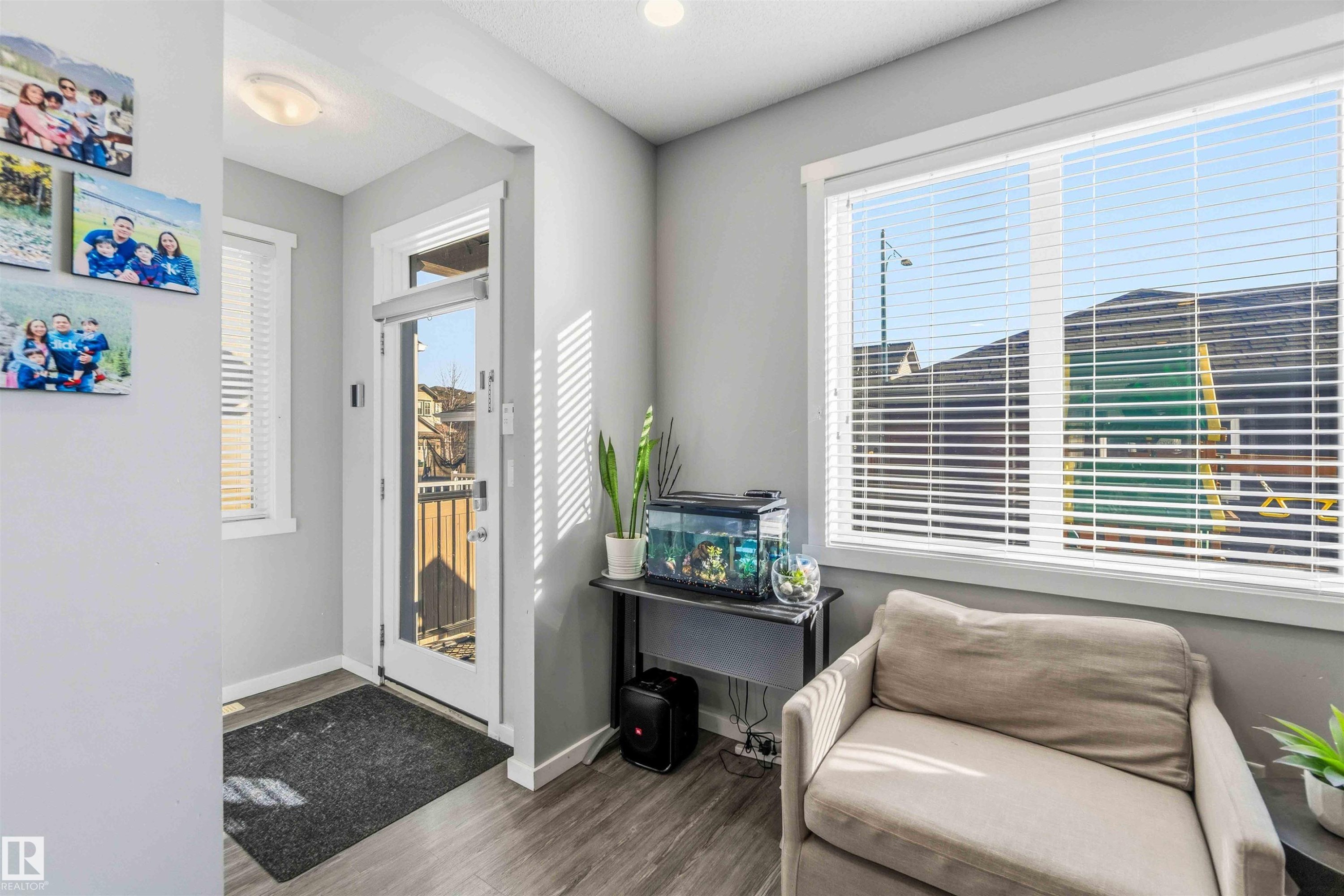 Sitting room featuring wood finished floors and baseboards - 1908 25 Street, Edmonton, AB - Indoor