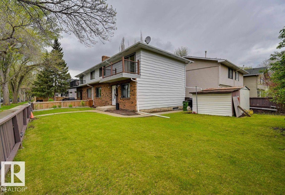 Back of house featuring a shed, a balcony, and brick siding - 10602 66 Avenue, Edmonton, AB - Outdoor