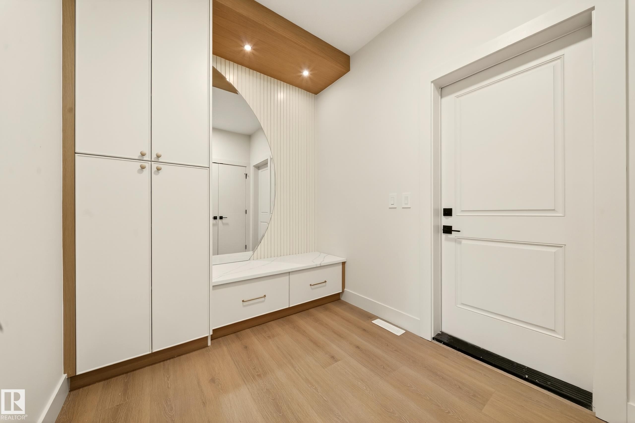 Mudroom with light wood-style floors and recessed lighting - 8924 Mayday Way, Edmonton, AB