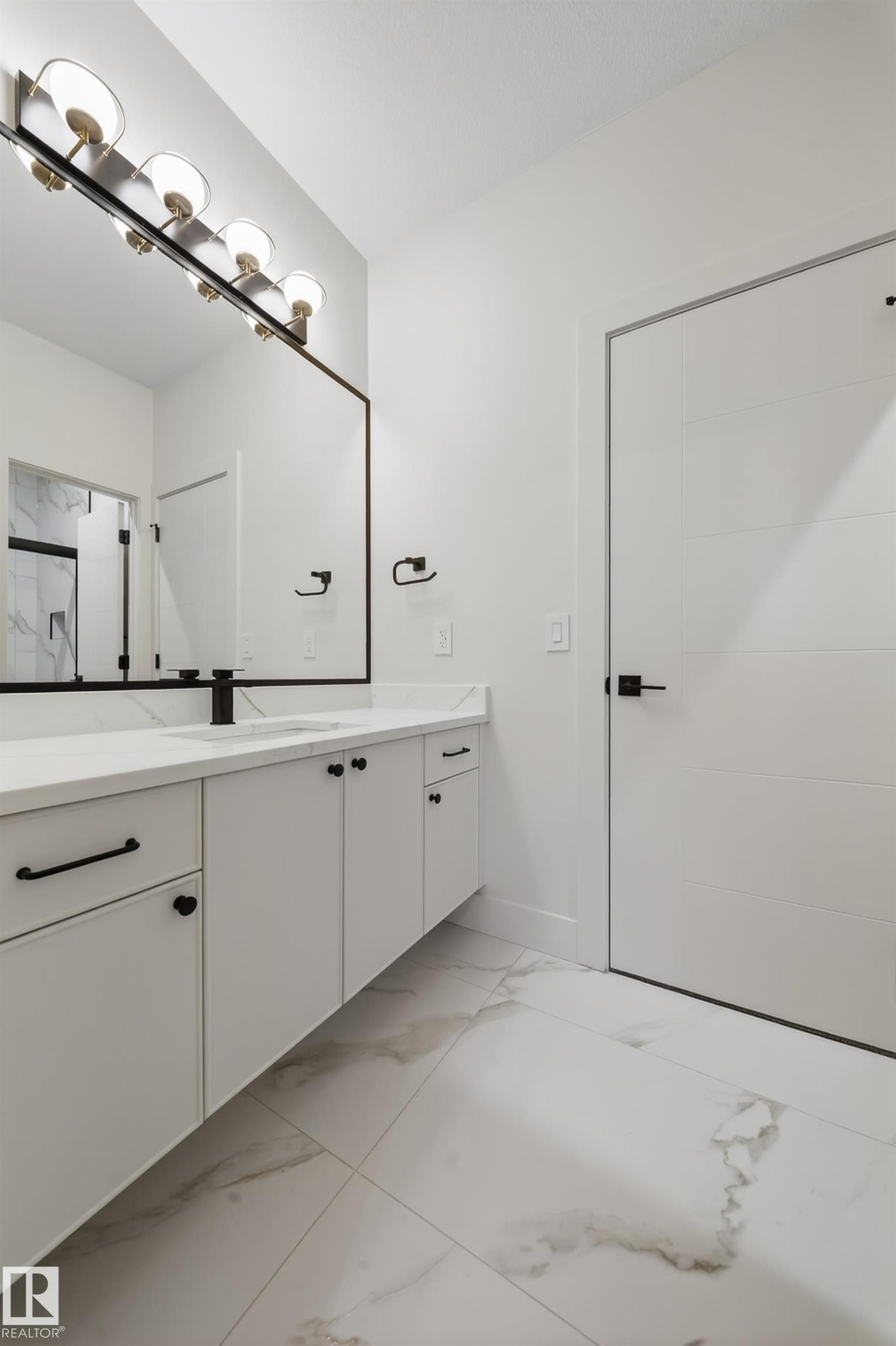 Bathroom featuring vanity and light marble finish floors - 8924 Mayday Way, Edmonton, AB - Indoor