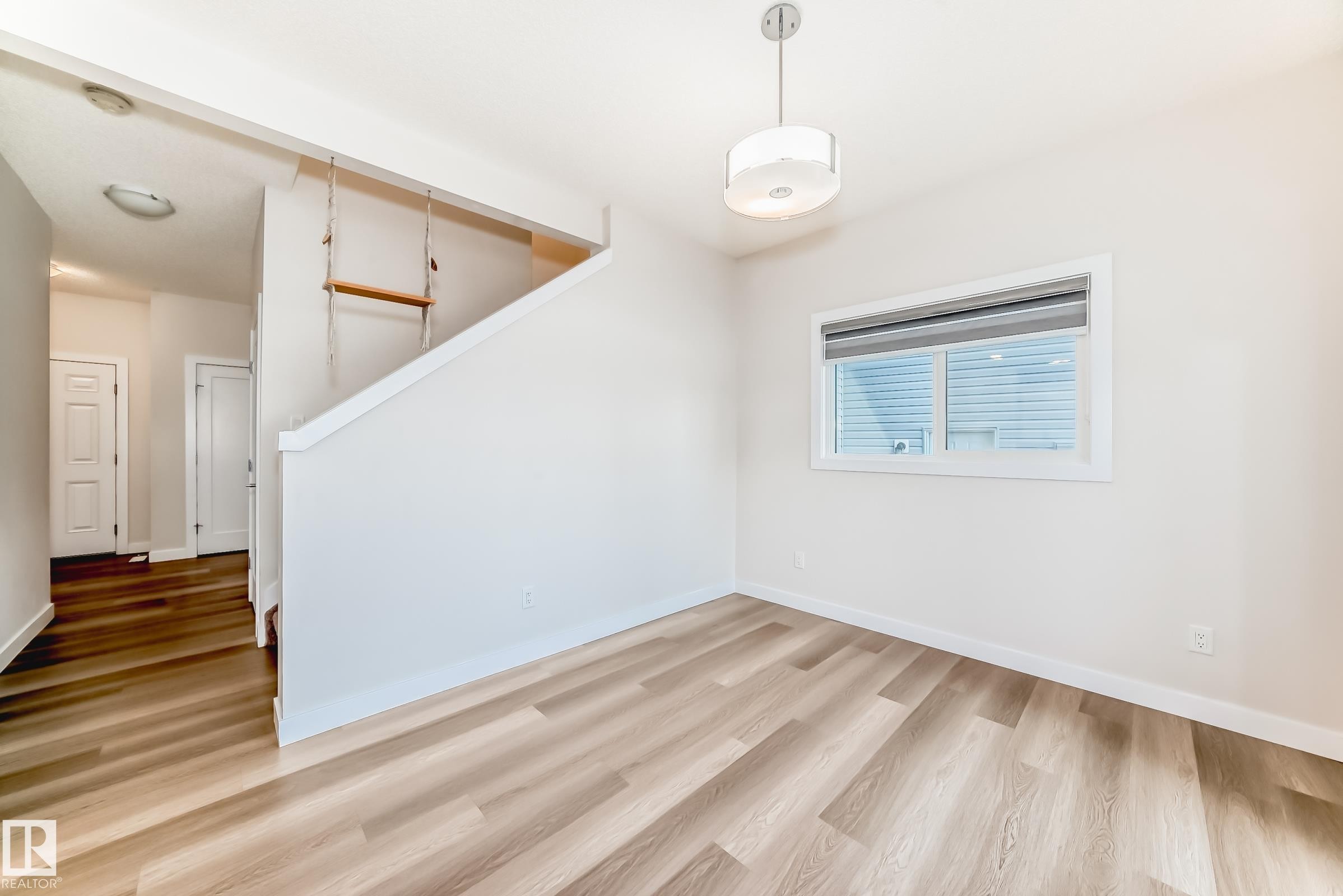 Unfurnished room with light wood finished floors and baseboards - 17926 62A Street, Edmonton, AB - Indoor Photo Showing Other Room