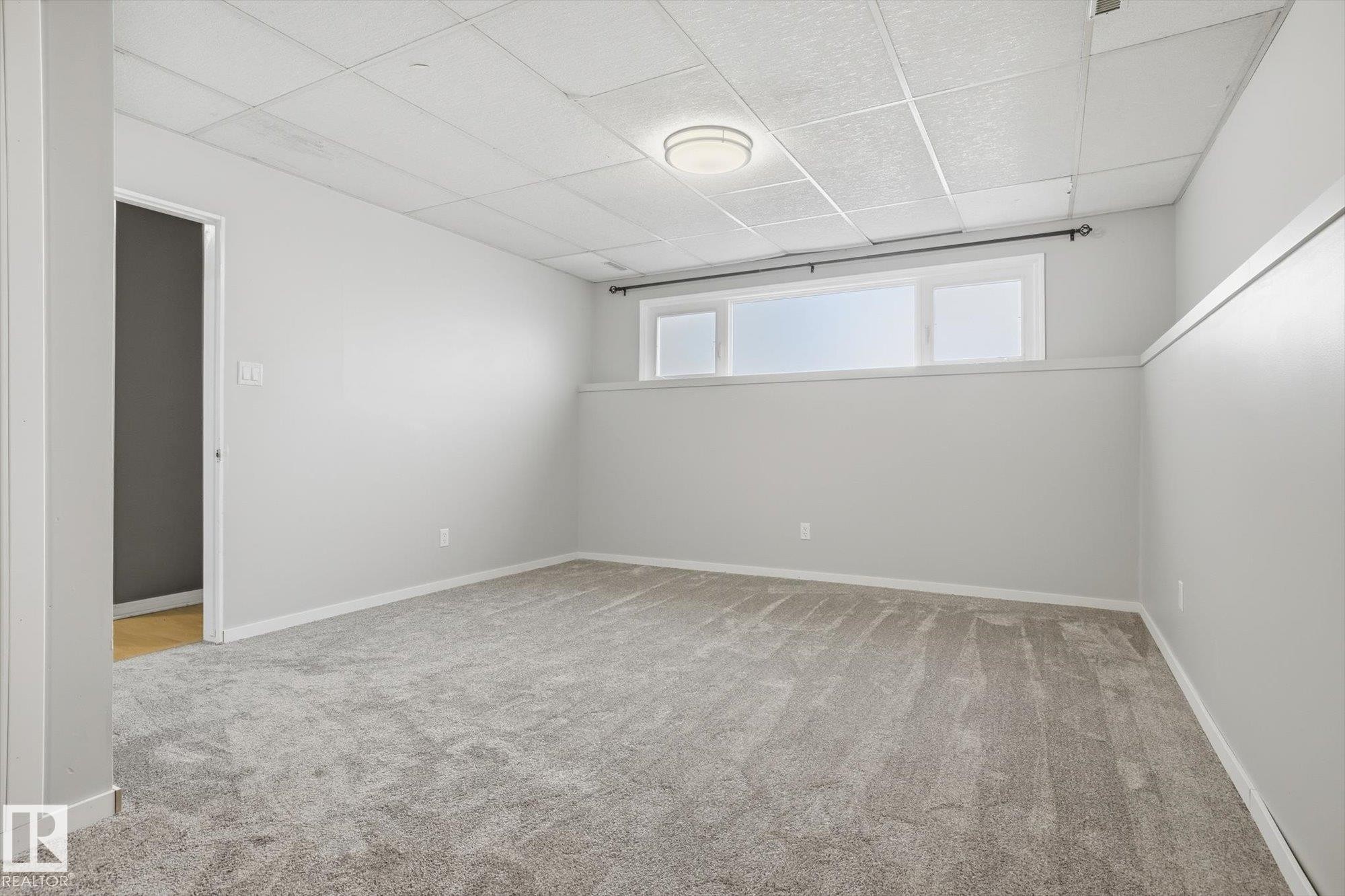 Big bright windows and new carpet. - 7807 145 Avenue, Edmonton, AB - Indoor Photo Showing Other Room